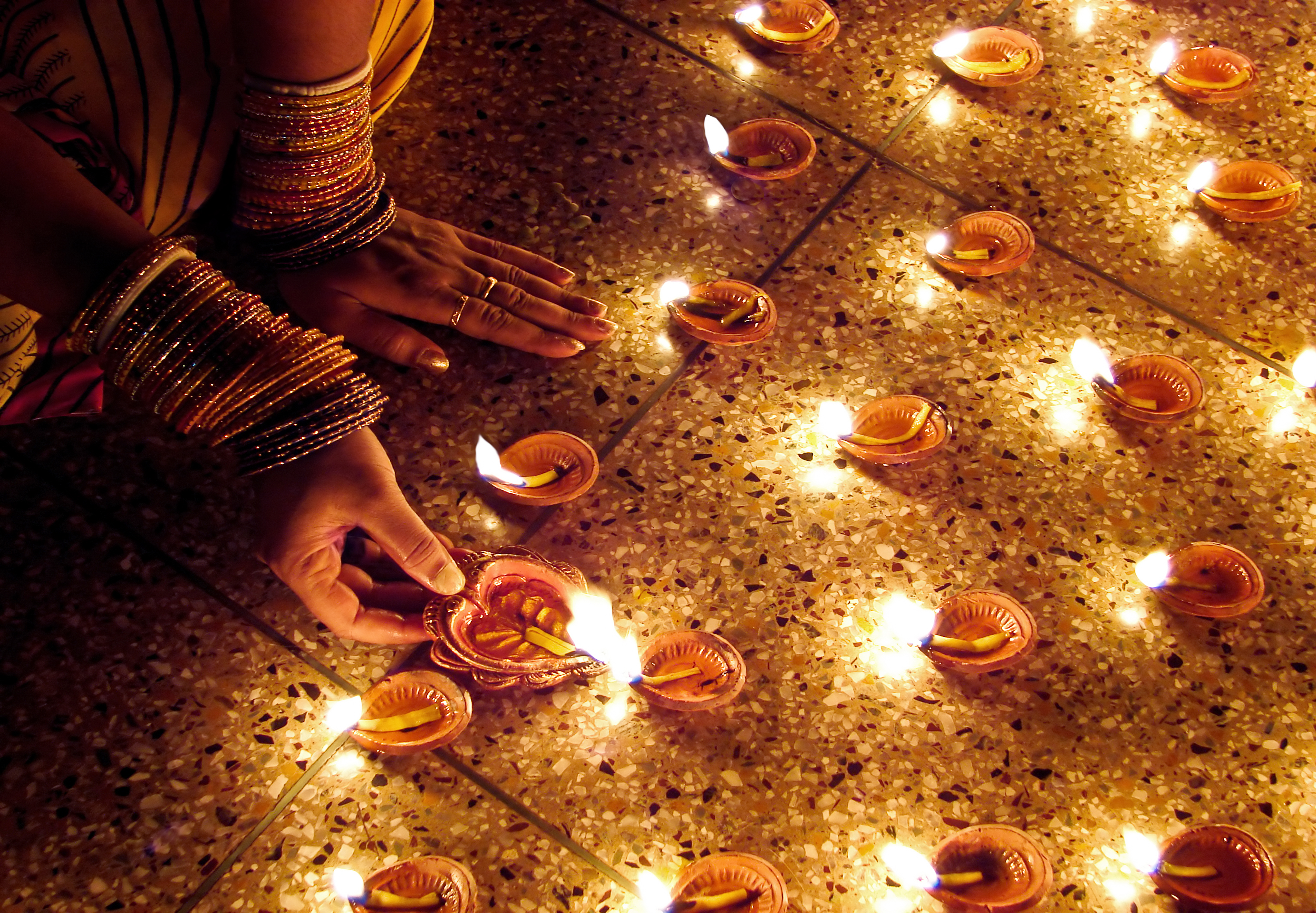 Woman hand lighting diva's