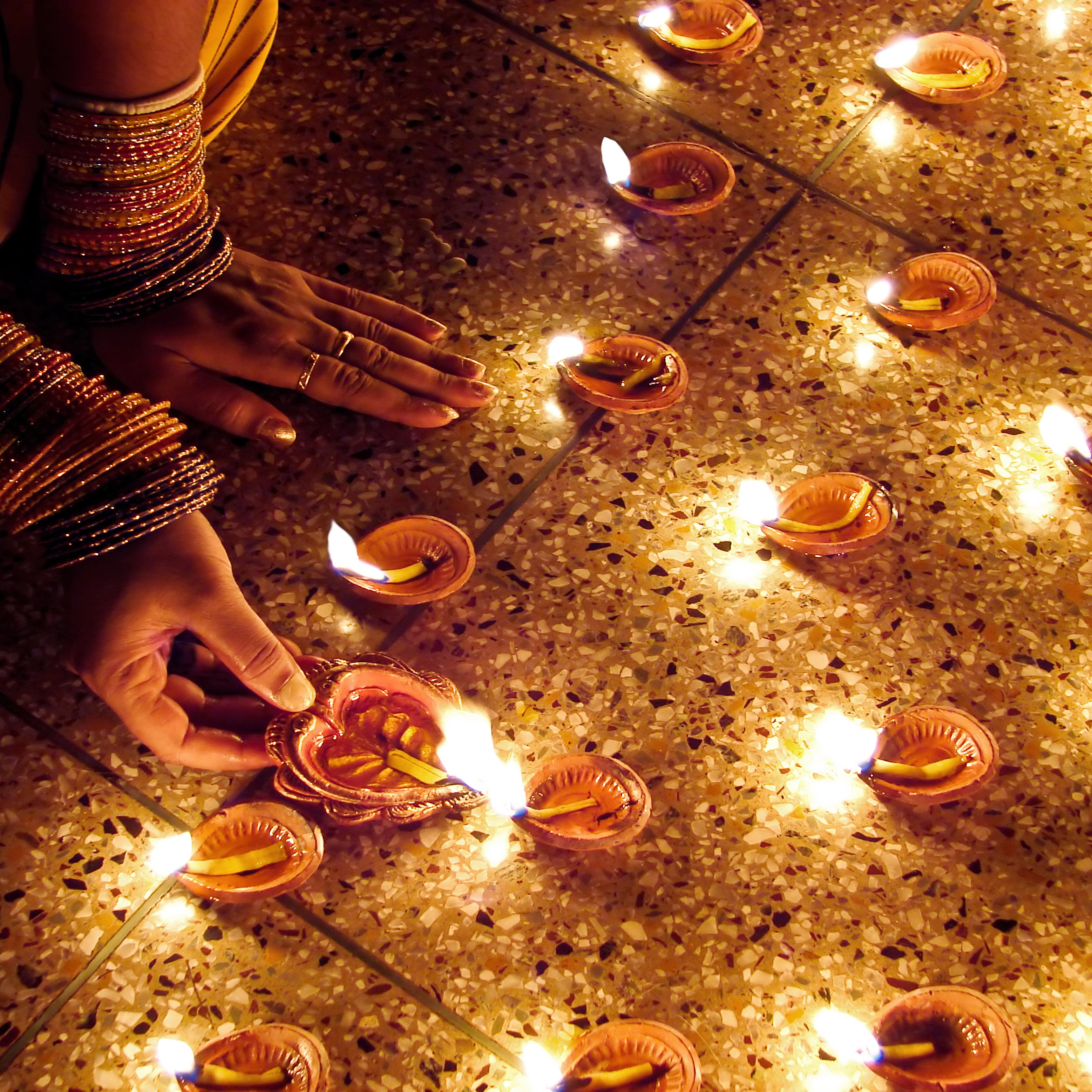 Woman hand lighting diva's