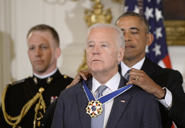 President Barack Obama (R) presents the Medal of Freedom to Vice-President Joe Biden during an event in the State Dining room of the White House, January 12, 2017 in Washington, DC.