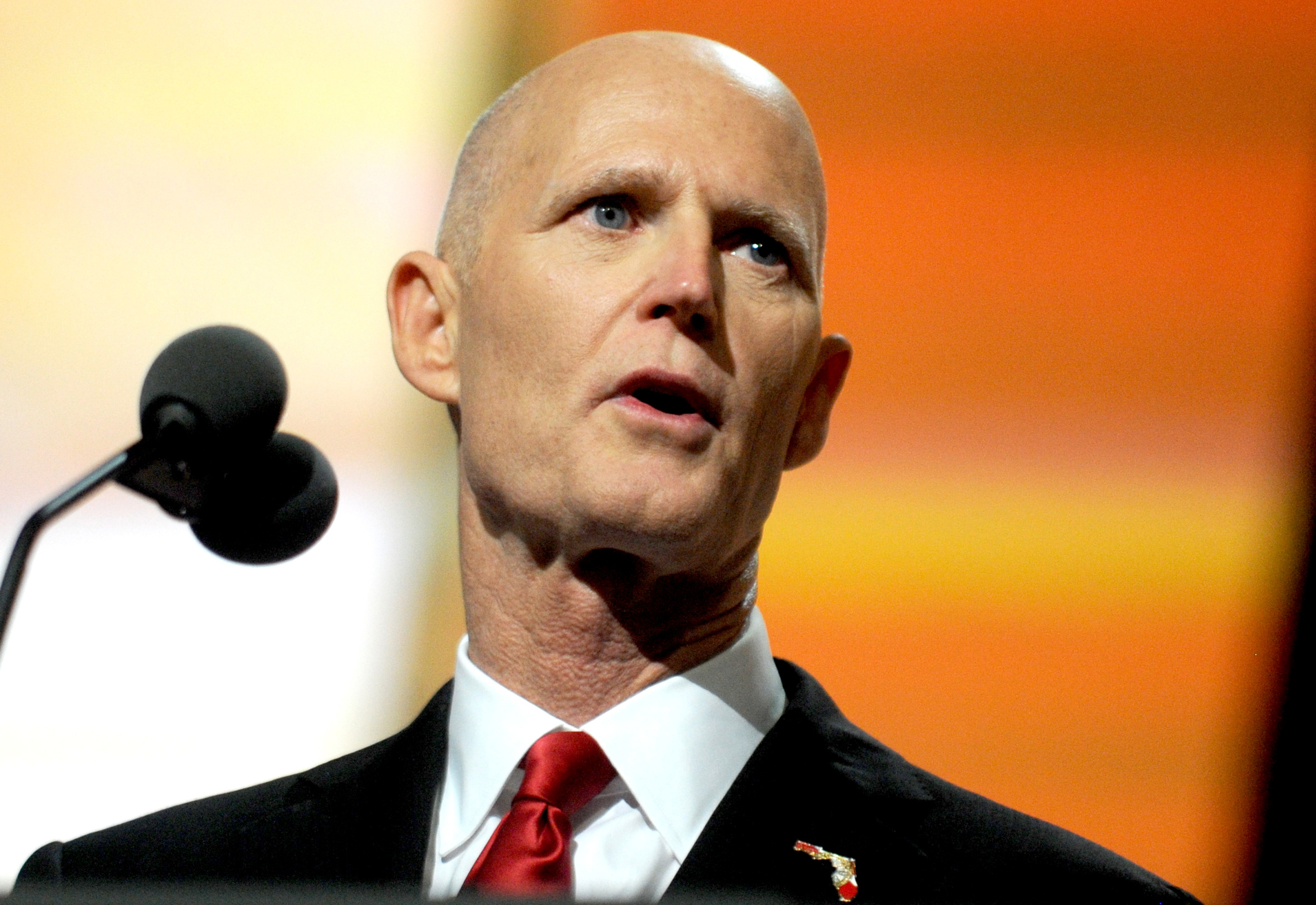 Florida Governor Rick Scott delivers a speech on the third day of the Republican National Convention on July 20, 2016 at the Quicken Loans Arena in Cleveland, Ohio. Republican presidential candidate Donald Trump received the number of votes needed to sec
