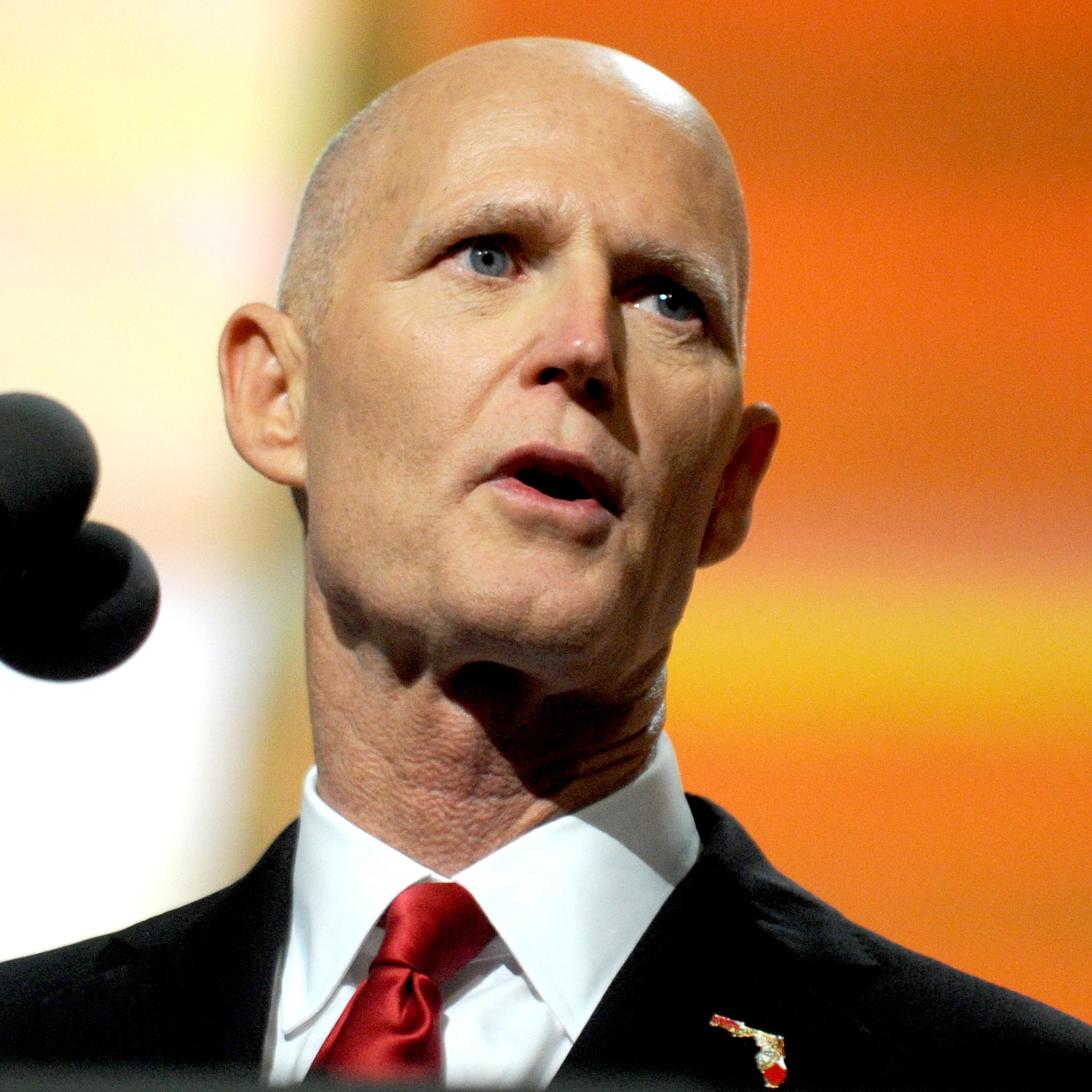 Florida Governor Rick Scott delivers a speech on the third day of the Republican National Convention on July 20, 2016 at the Quicken Loans Arena in Cleveland, Ohio. Republican presidential candidate Donald Trump received the number of votes needed to sec