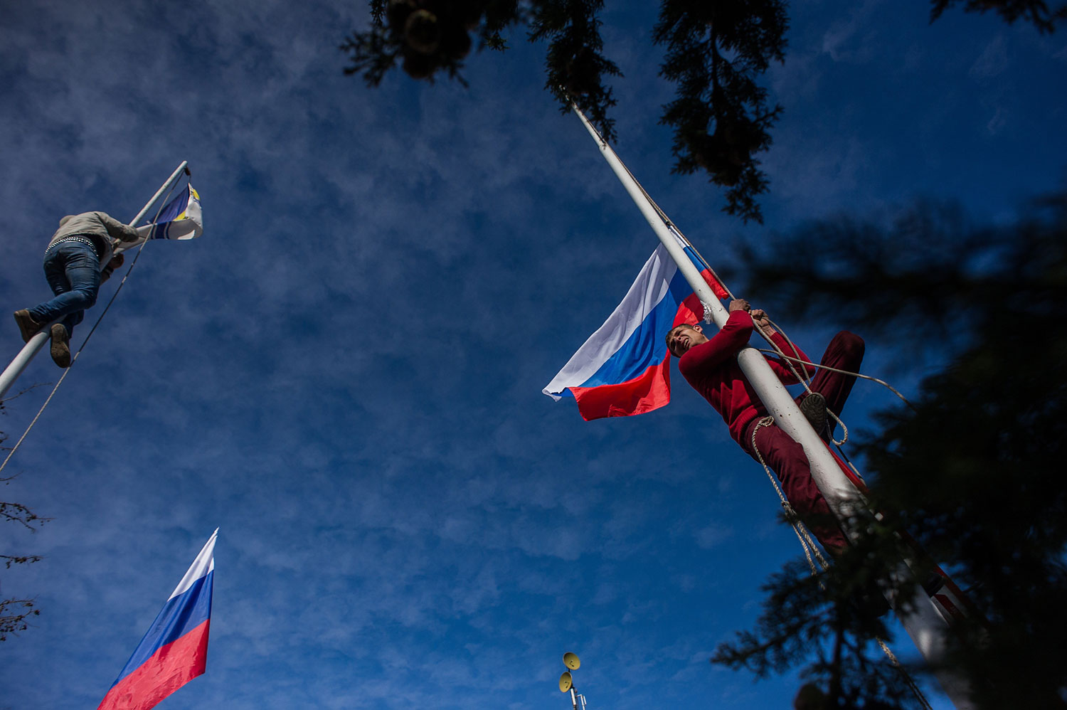 Russian President Vladimir Putin and Crimean Prime Minister Sergei Aksyonov attend a rally at Red Square on March 18, 2014 in Moscow.