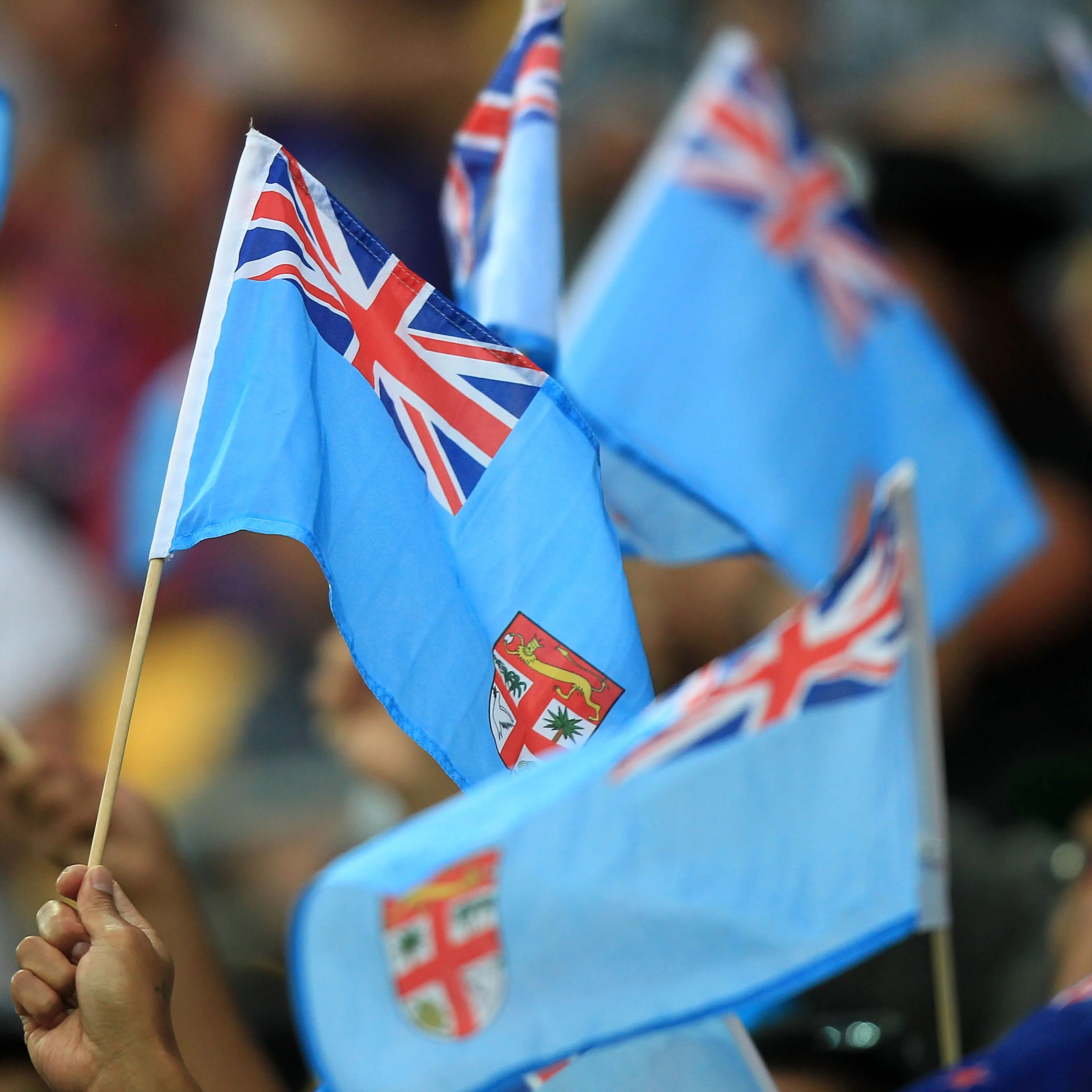 Fijian flags are waved during pool play