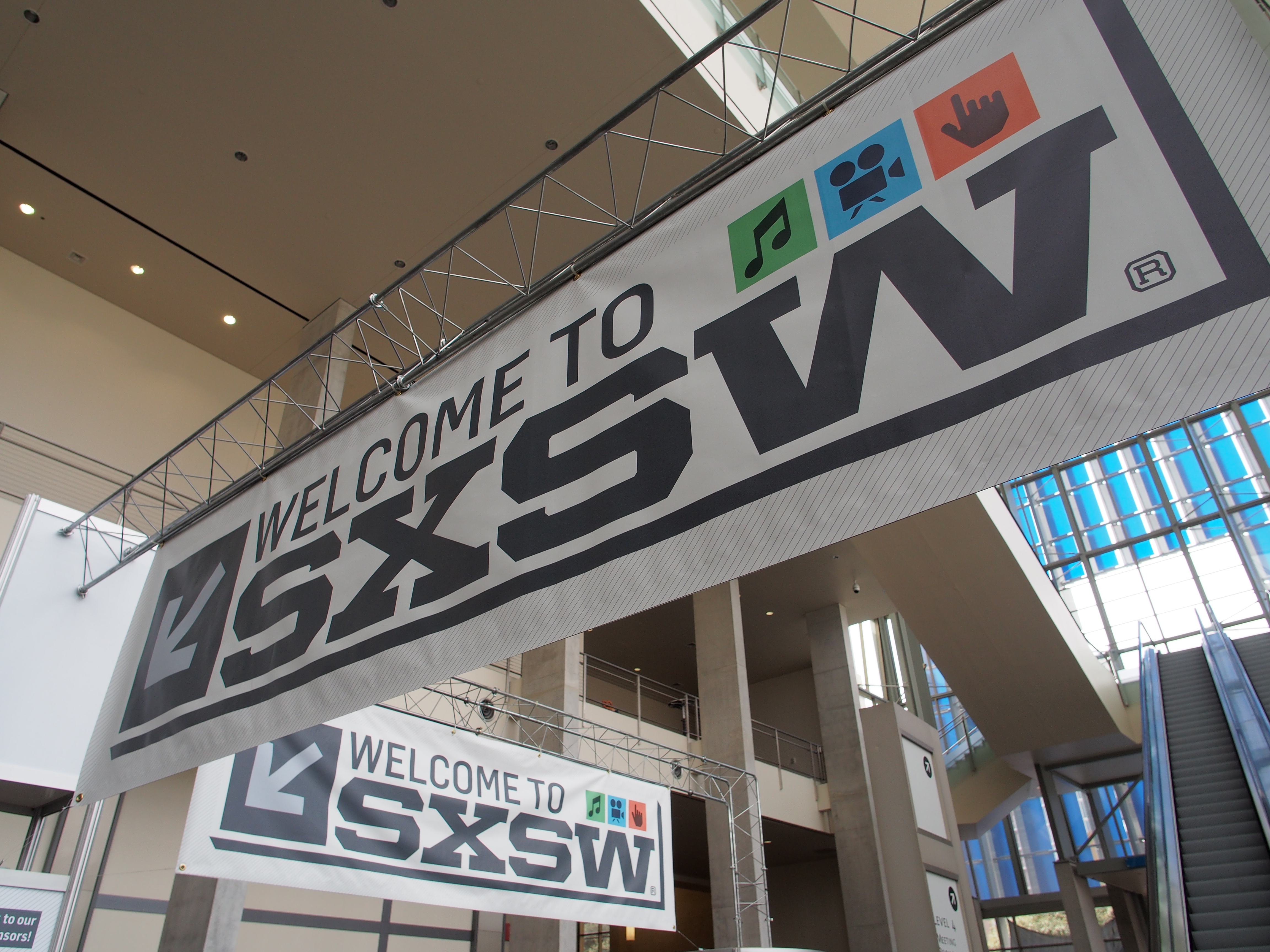Banners hang in the atrium of the Austin Convention Center on Thursday, March 7, 2012 on the eve of the opening of the 27th South By Southwest (SXSW) interactive, film and music festival.