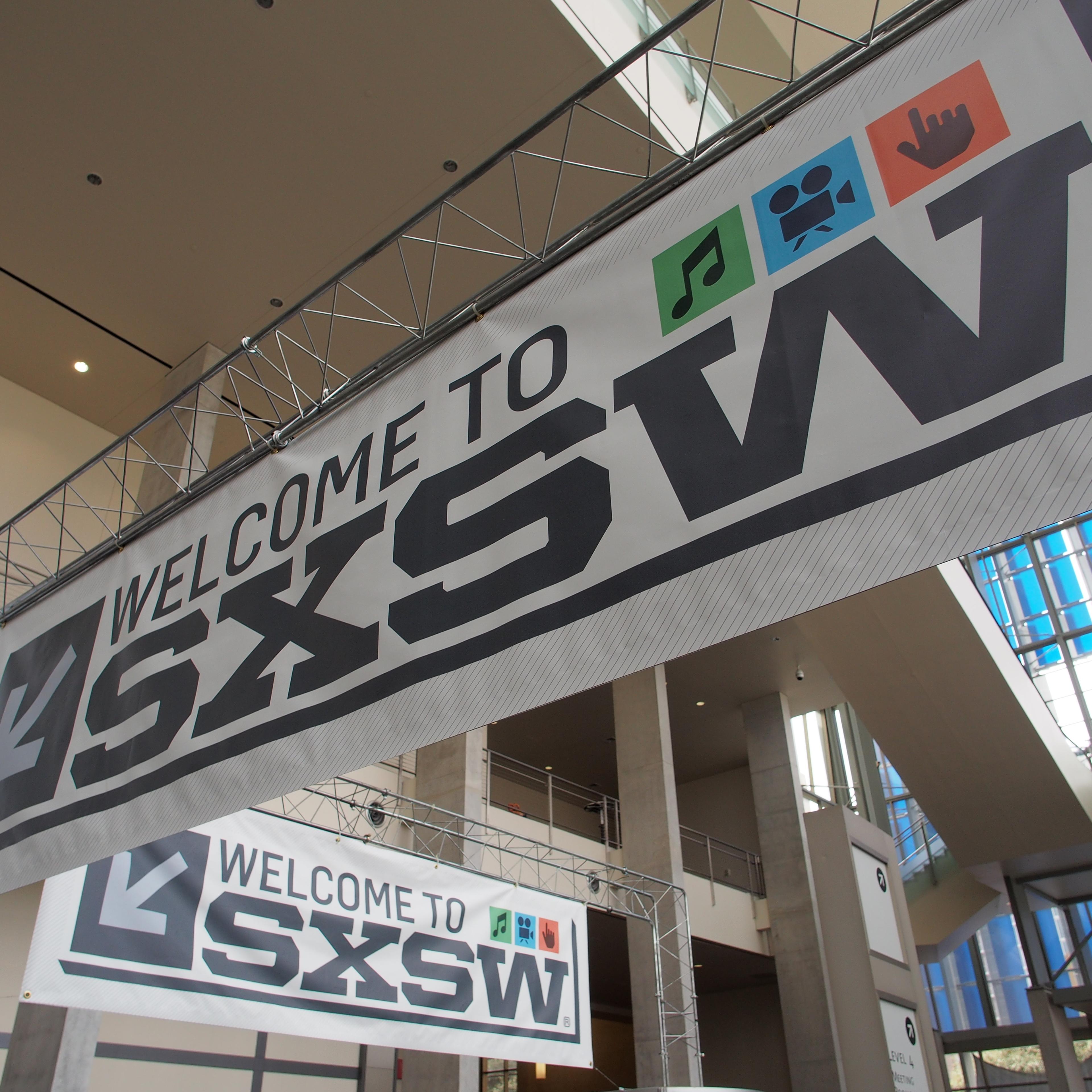 Banners hang in the atrium of the Austin Convention Center on Thursday, March 7, 2012 on the eve of the opening of the 27th South By Southwest (SXSW) interactive, film and music festival.