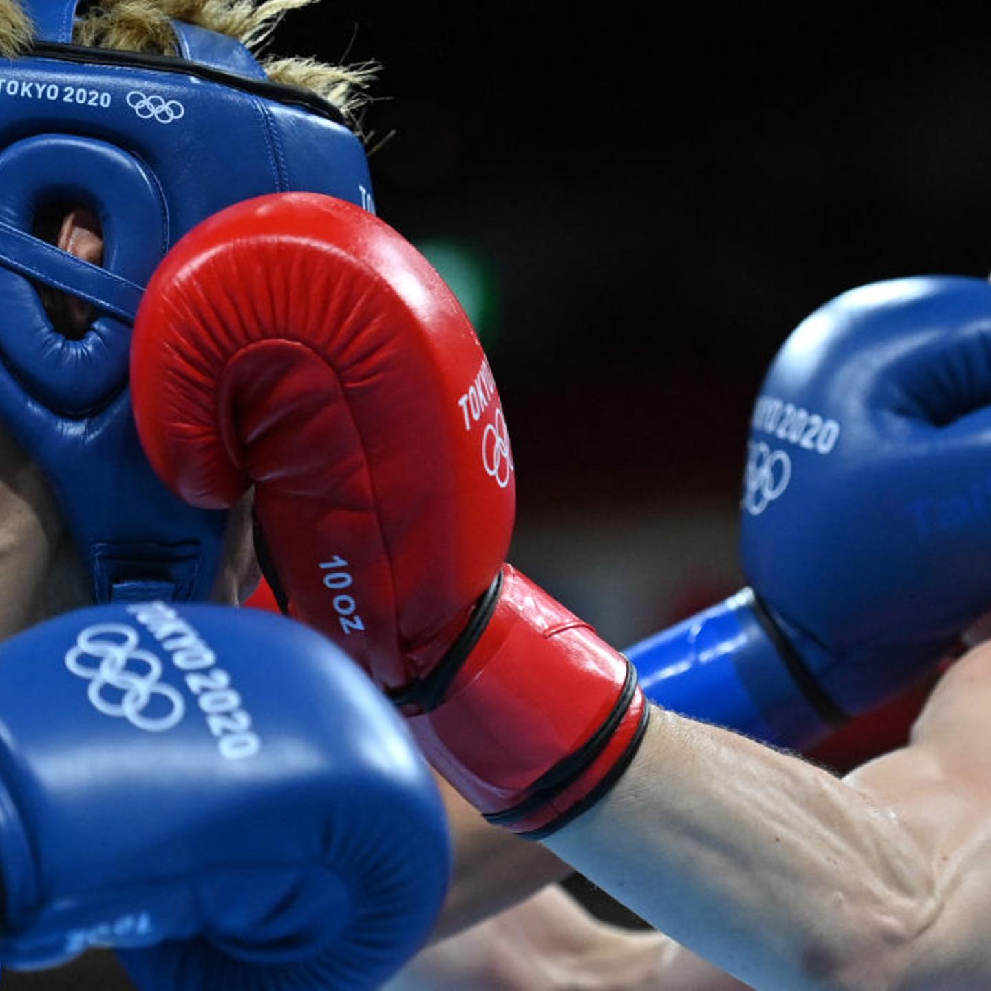 Ireland's Kellie Anne Harrington (red) and Algeria's Imane Khelif fight during their women's light (57-60kg) quarter-final boxing match during the Tokyo 2020 Olympic Games at the Kokugikan Arena in Tokyo on Aug. 3, 2021.