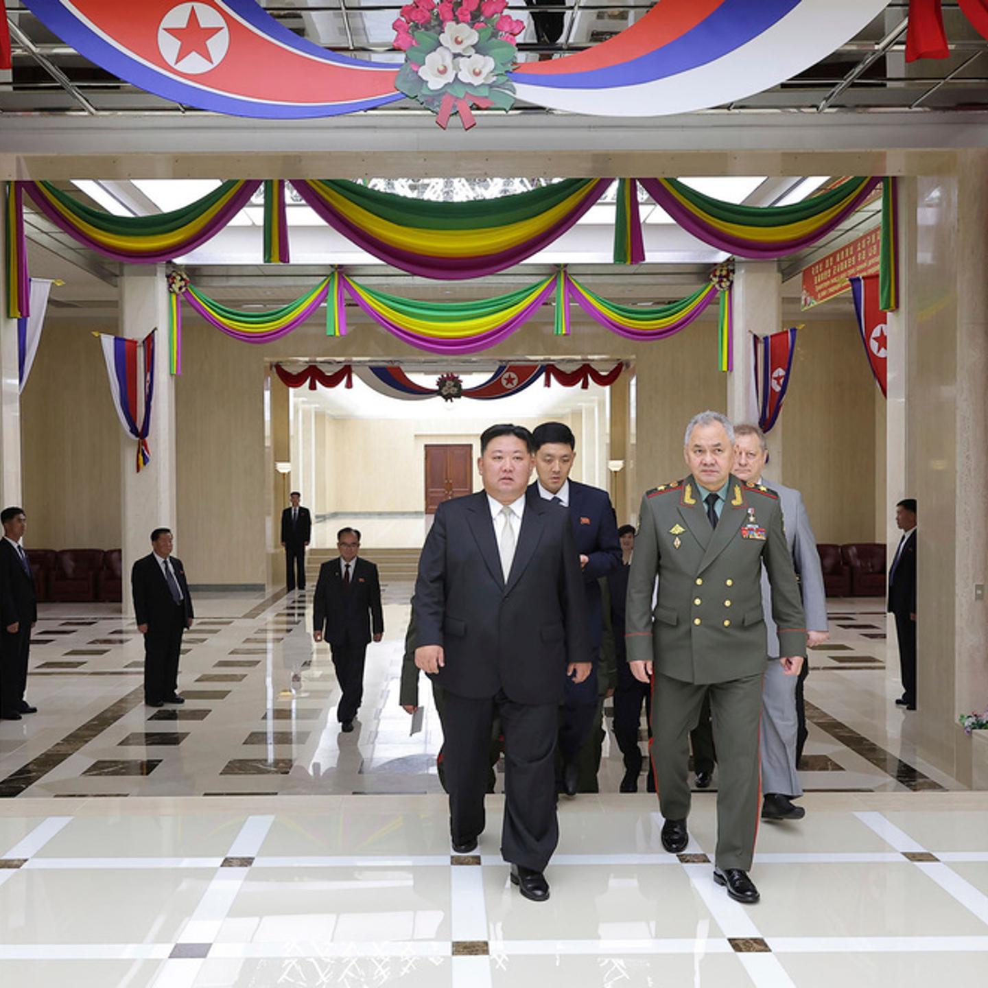 In this photo provided by the North Korean government, North Korean leader Kim Jong Un, center, and Russian Defense Minister Sergei Shoigu, left, head to a banquet hall, at the ruling Workers’ Party’s headquarters in Pyongyang, North Korea Thursday, July