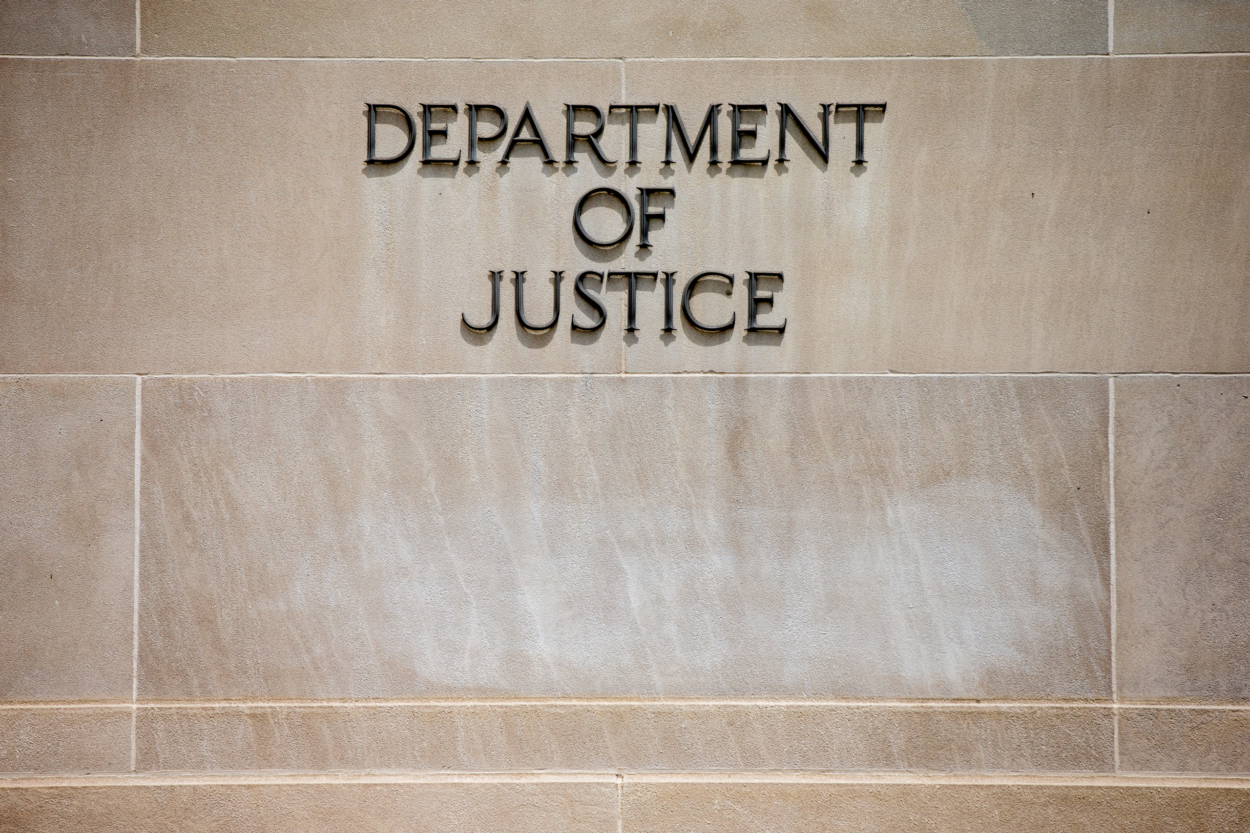In this photo taken June 19, 2015, the Justice Department Building in Washington. A federal government contractor has been accused of removing highly classified information and storing the material in his house and car, federal prosecutors announced Wedn
