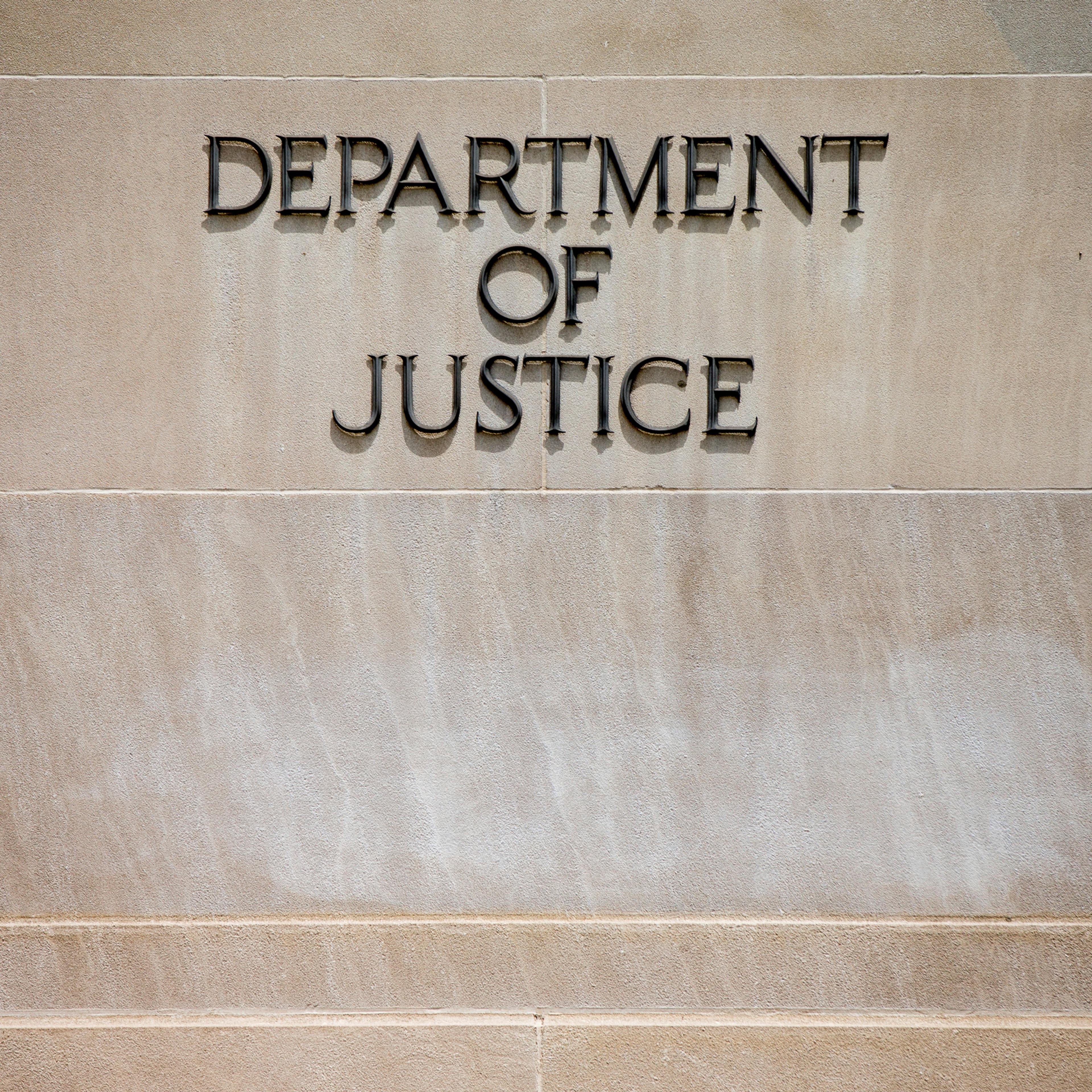 In this photo taken June 19, 2015, the Justice Department Building in Washington. A federal government contractor has been accused of removing highly classified information and storing the material in his house and car, federal prosecutors announced Wedn