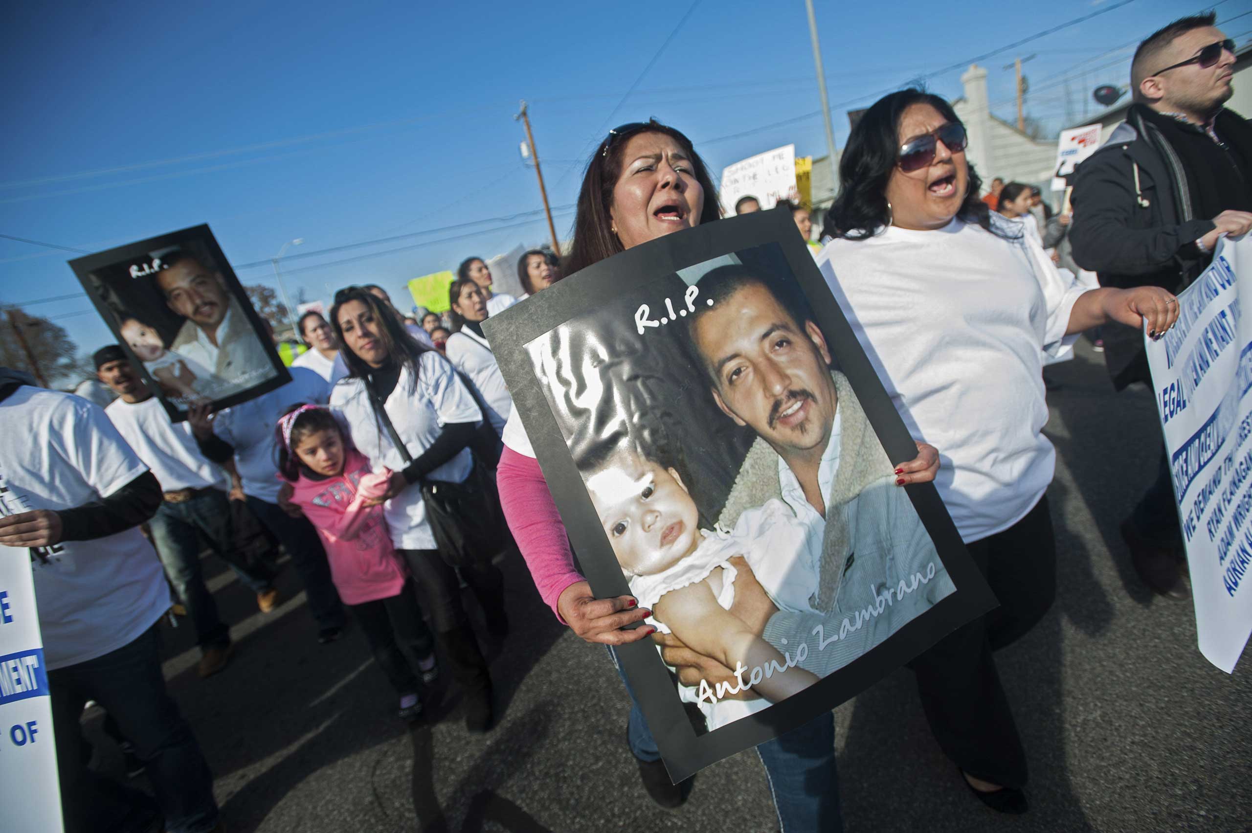 archers carry posters of Antonio Zambrano-Montes during a protest over the police killing on Tuesday of the Mexican-born apple picker, in Pasco.