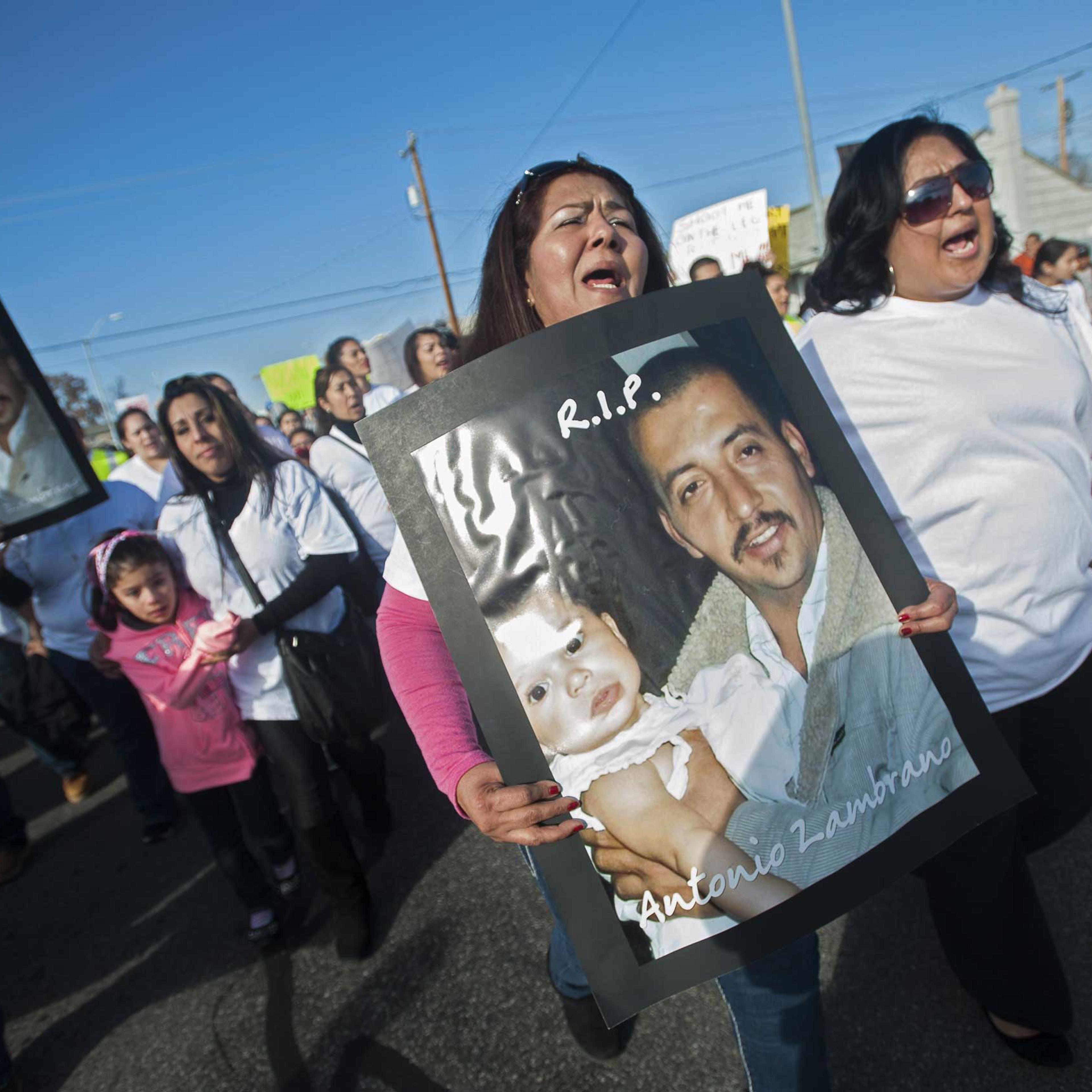 archers carry posters of Antonio Zambrano-Montes during a protest over the police killing on Tuesday of the Mexican-born apple picker, in Pasco.