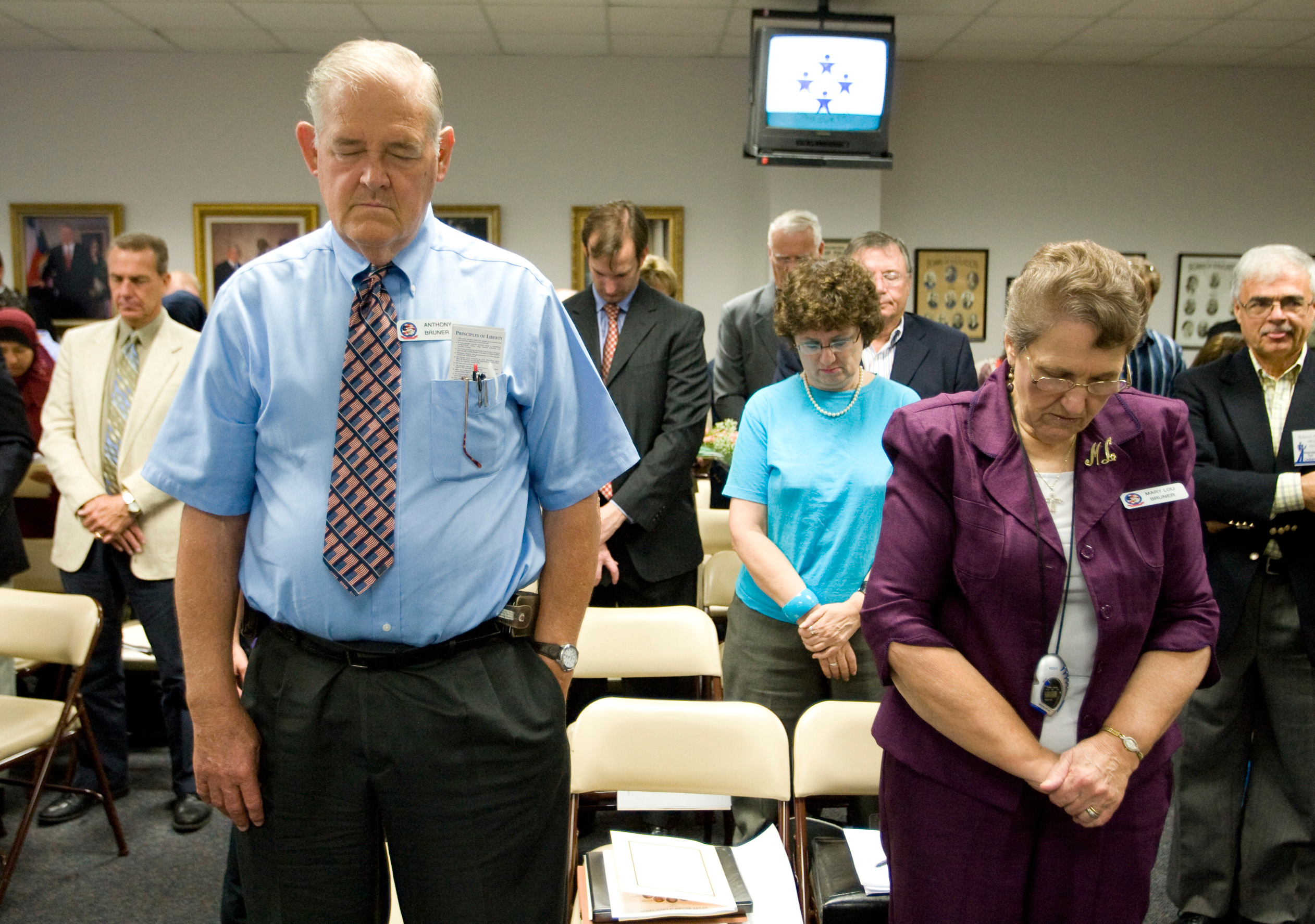 FILE - In this Sept. 24, 2010 file photo, Anthony Bruner and Mary Lou Bruner, right, pray at the start of a meeting of the Texas State Board of Education to discuss Islam and Christianity in textbooks in Austin, Texas. Mary Lou Bruner, a retired Texas sc
