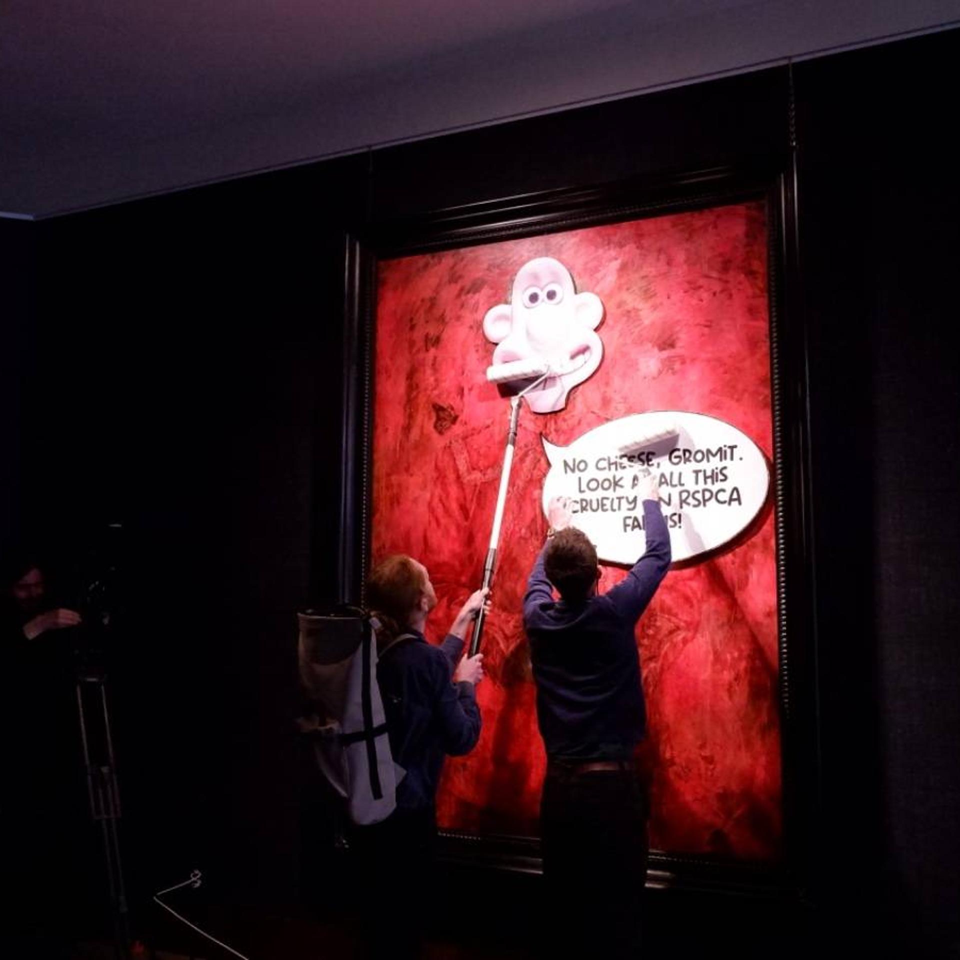 Animal Rising protestors overlay cartoon image on King Charles III's portrait