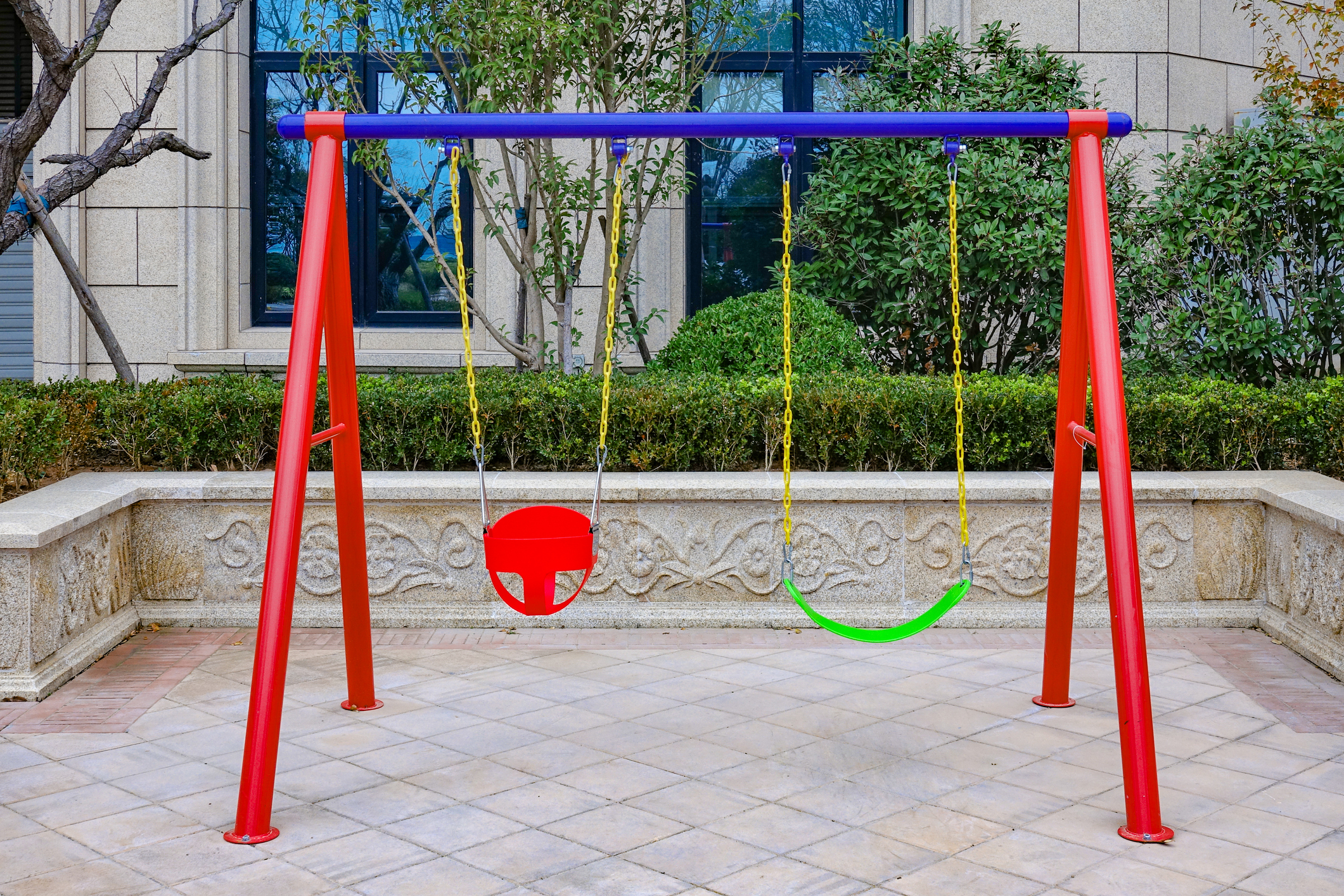 An empty children’s swingset in Qingdao, China