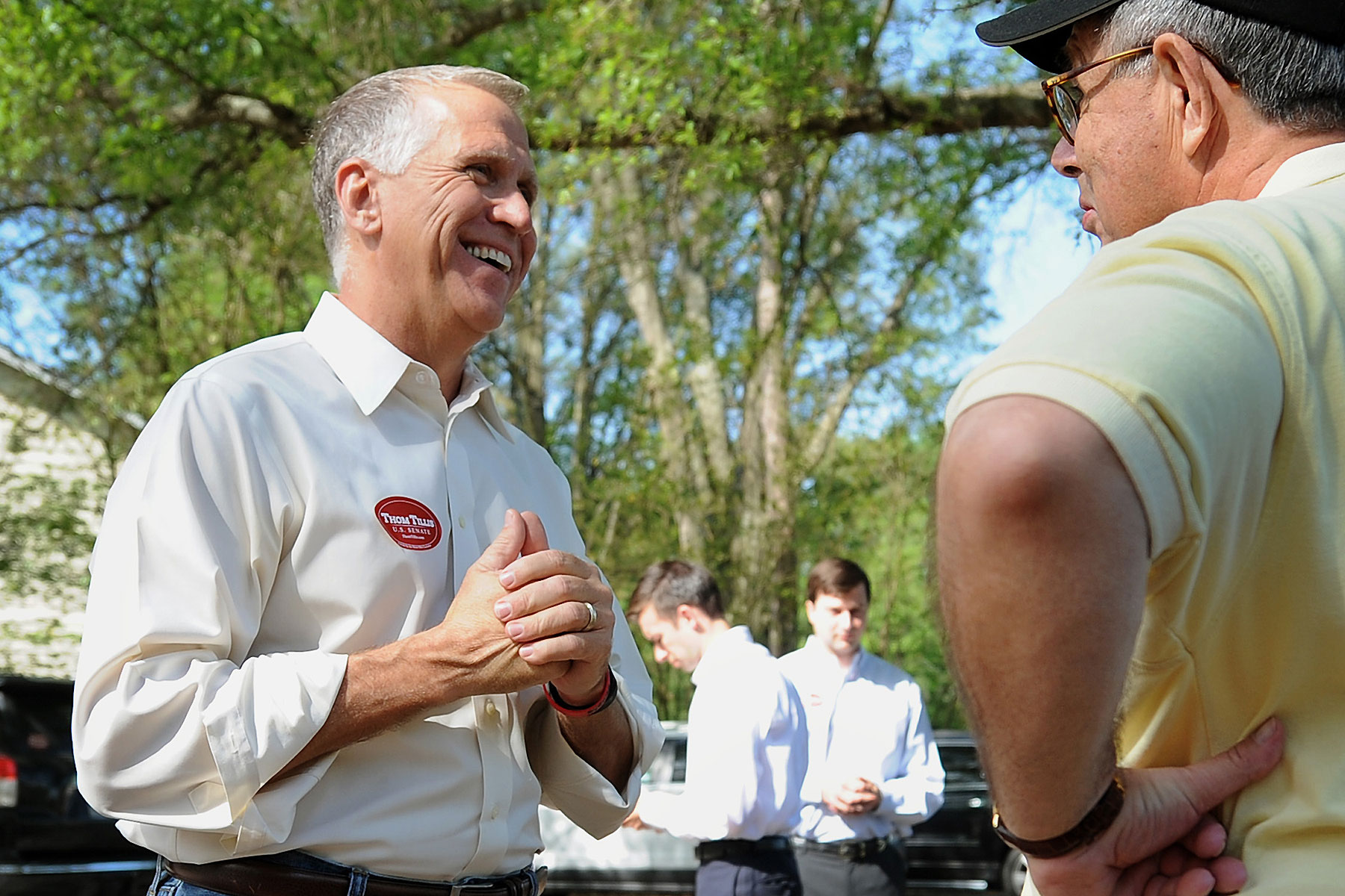 N.C. House Speaker Thom Tillis, left, talks with voter Donald Parrott of Charlotte outside Precinct 75 at Holy Covenant UCC in Charlotte, N.C., on May 6, 2014