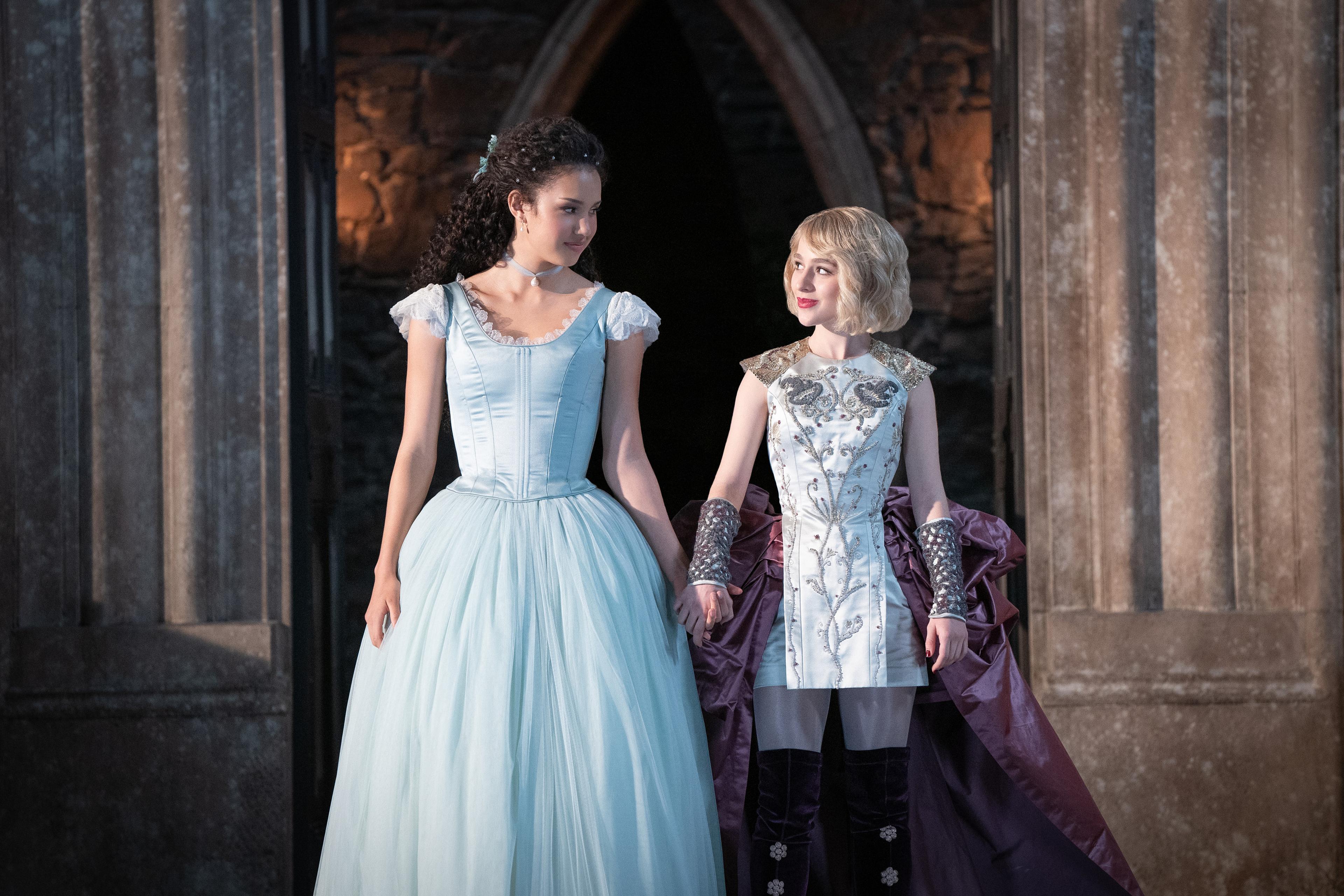 The two main characters standing in a doorway
