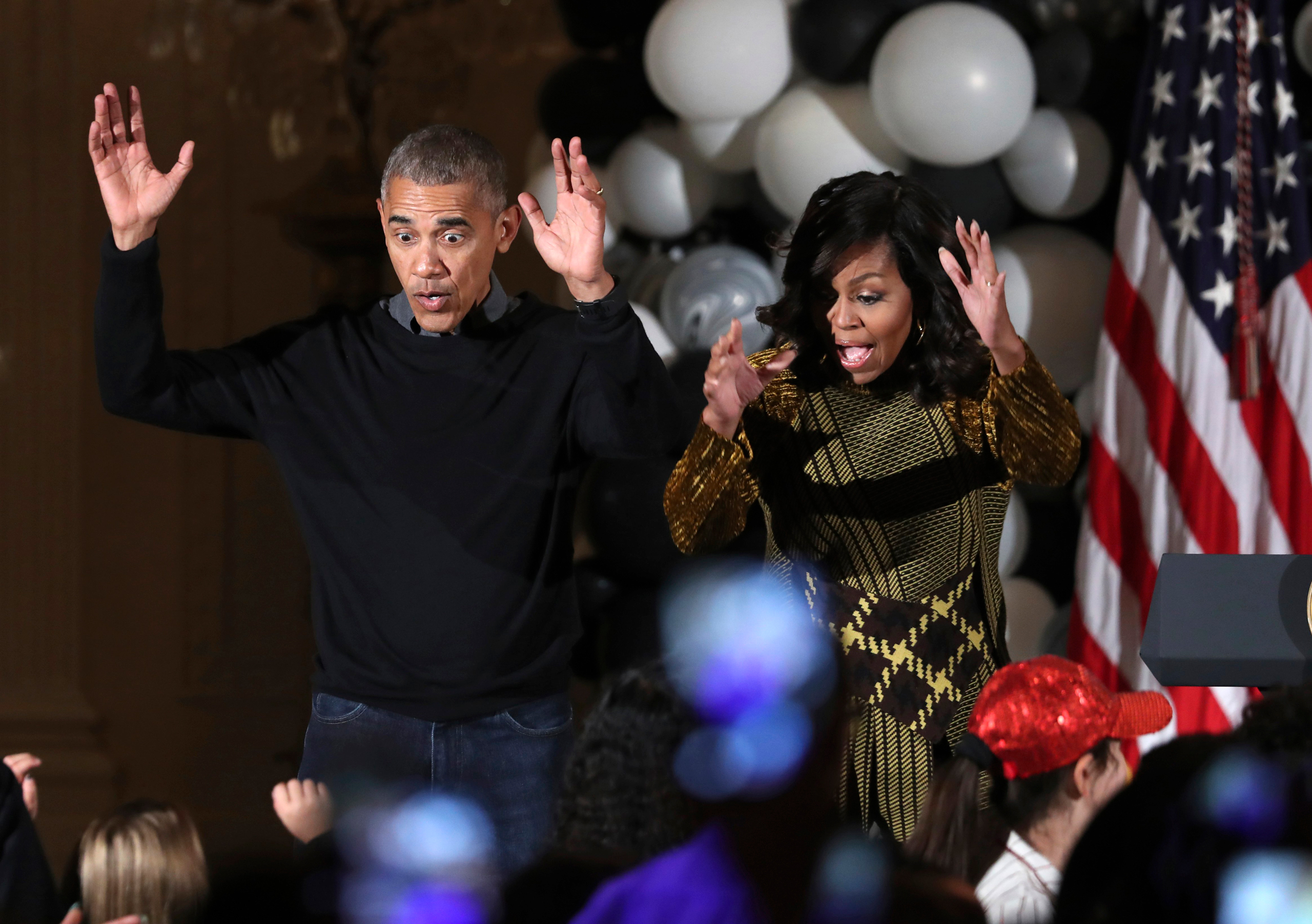 President Barack Obama and the first lady Michelle Obama dance to the beat of Michael Jackson's "Thriller" at they welcome children from Washington area and children of military families to trick-or-treat celebrating Halloween at the South Portico of the