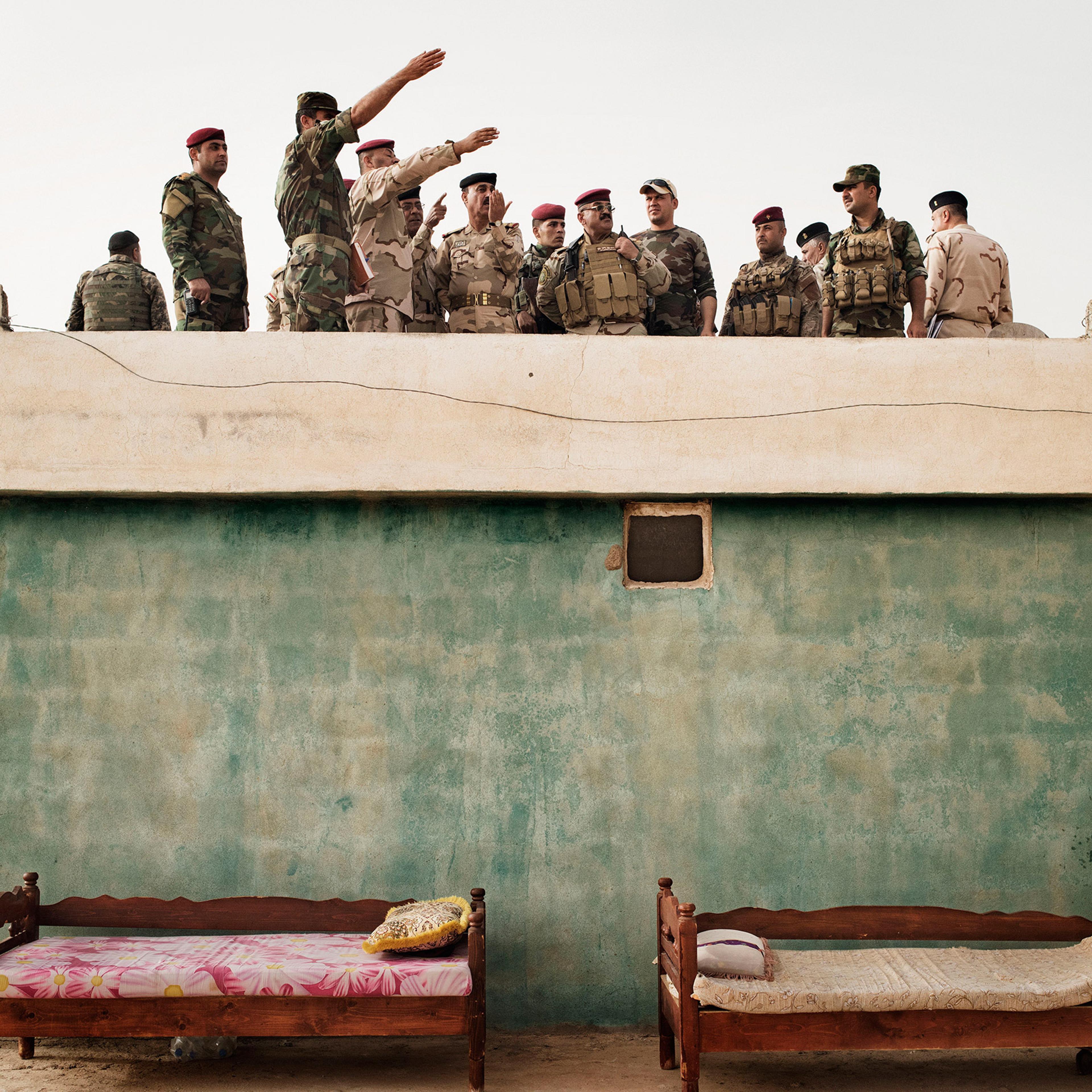 Iraqi Army commanders survey the front line in the villageof Kharbardan, south of Mosul, May 18, 2016. The Iraqi military seized the village from ISIS in March, as a part of a grinding march toward the city of Mosul, a major city that has been under ISIS control since June 2014.<br><br>From <a href="http://time.com/4372463/yuri-kozyrev-back-to-iraq/">"Yuri Kozyrev: On the Front Lines of the War Against ISIS"</a>