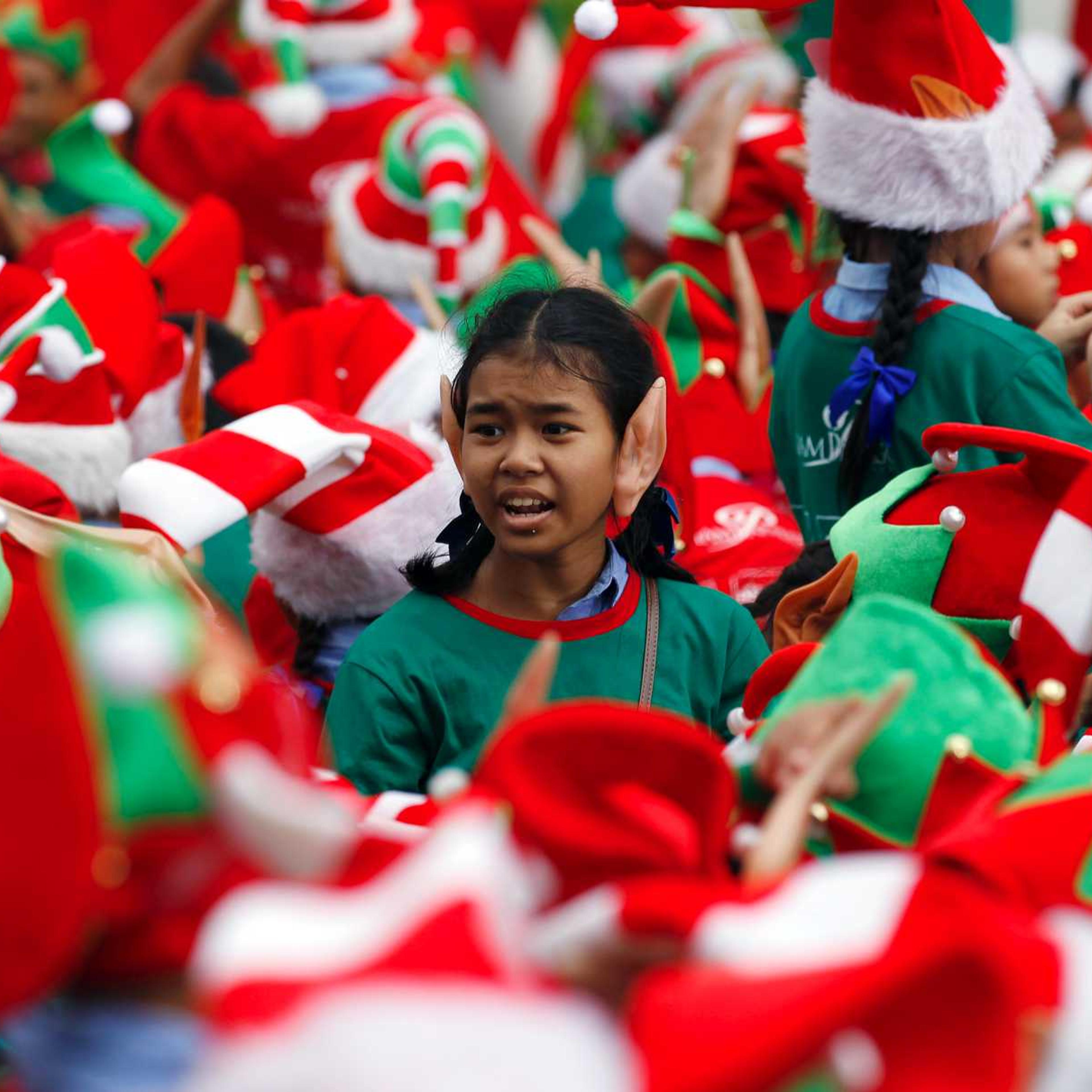 Students gather to break the Guinness World Record for the largest gathering of Christmas elves outside a shopping mall in Bangkok on Nov. 25, 2014