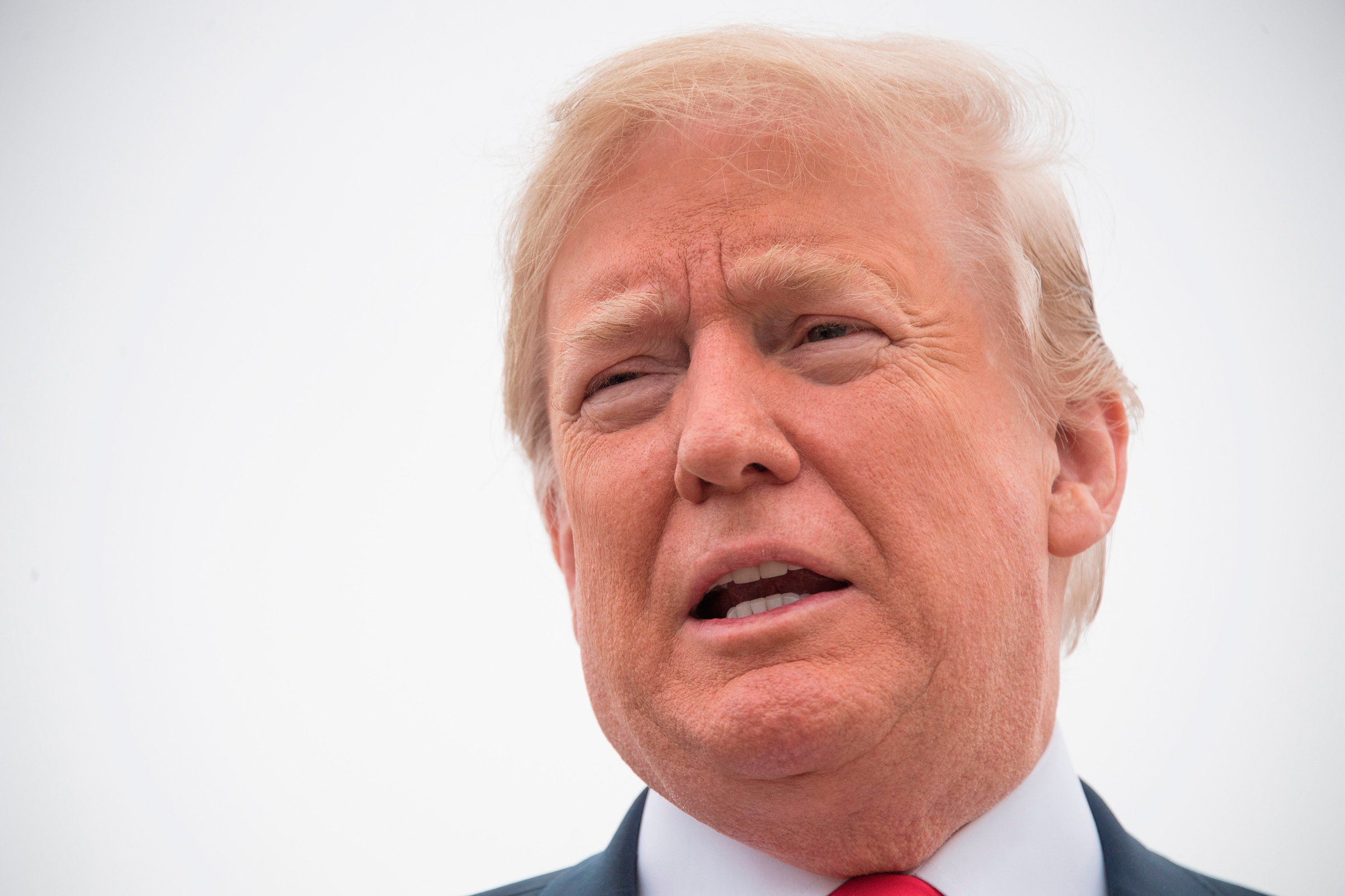 President Donald Trump talks to the press before boarding Air Force One at Andrews Air Force Base, Maryland, on May 31, 2018.