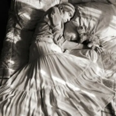 Madje Steber naps with her favorite toy, a stuffed kitty, in her room at Midtown Manor, an assisted living facility, in Hollywood, FL. in 2007.