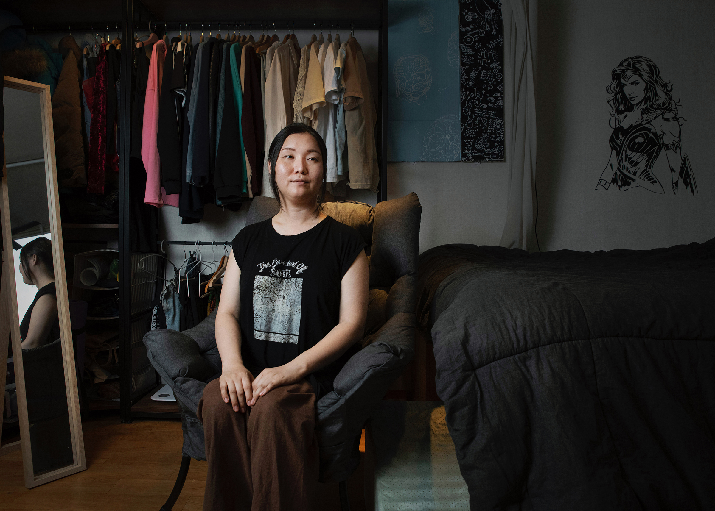 Park Edhi poses for a portrait at her home in Itaewon, Seoul, on June 21. Park moved into this apartment in January 2020, just before the COVID-19 pandemic. Transphobia was also running high. "Hatred was just pouring out. It was an incredibly difficult time," says Park. Referring to the high-profile dismissal and death of Sgt. Byun Hee-soo, as well as the case of a transgender student who faced backlash for getting acceptance to a women's university, Park says: "Even with gender confirmation surgery, not being able to go to school? Or a transwoman soldier who wanted to serve but couldn't ... What are we supposed to do?" Park says the lack of policies to protect basic rights has left her in a state of hopelessness. "I went to five funerals in two months. You know how, when you get wounded, you put medicine on it and the wound scabs over? I'm in that scab period. And this home is my safe space."