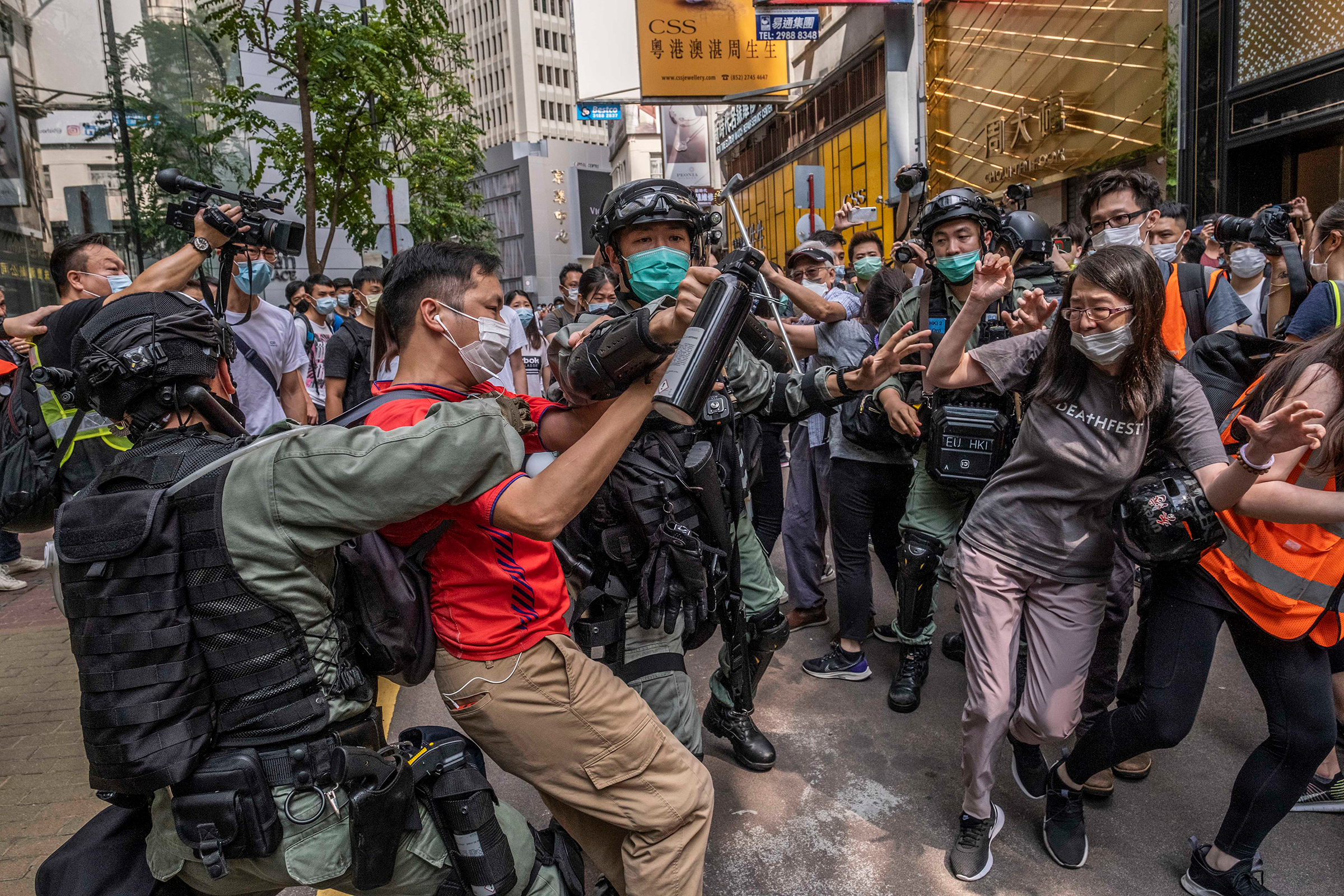 Riot police officers clash with protesters in Hong Kong on May 27, 2020.