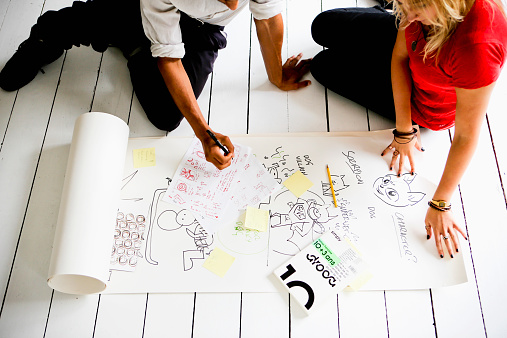 colleagues-brainstorming-floor