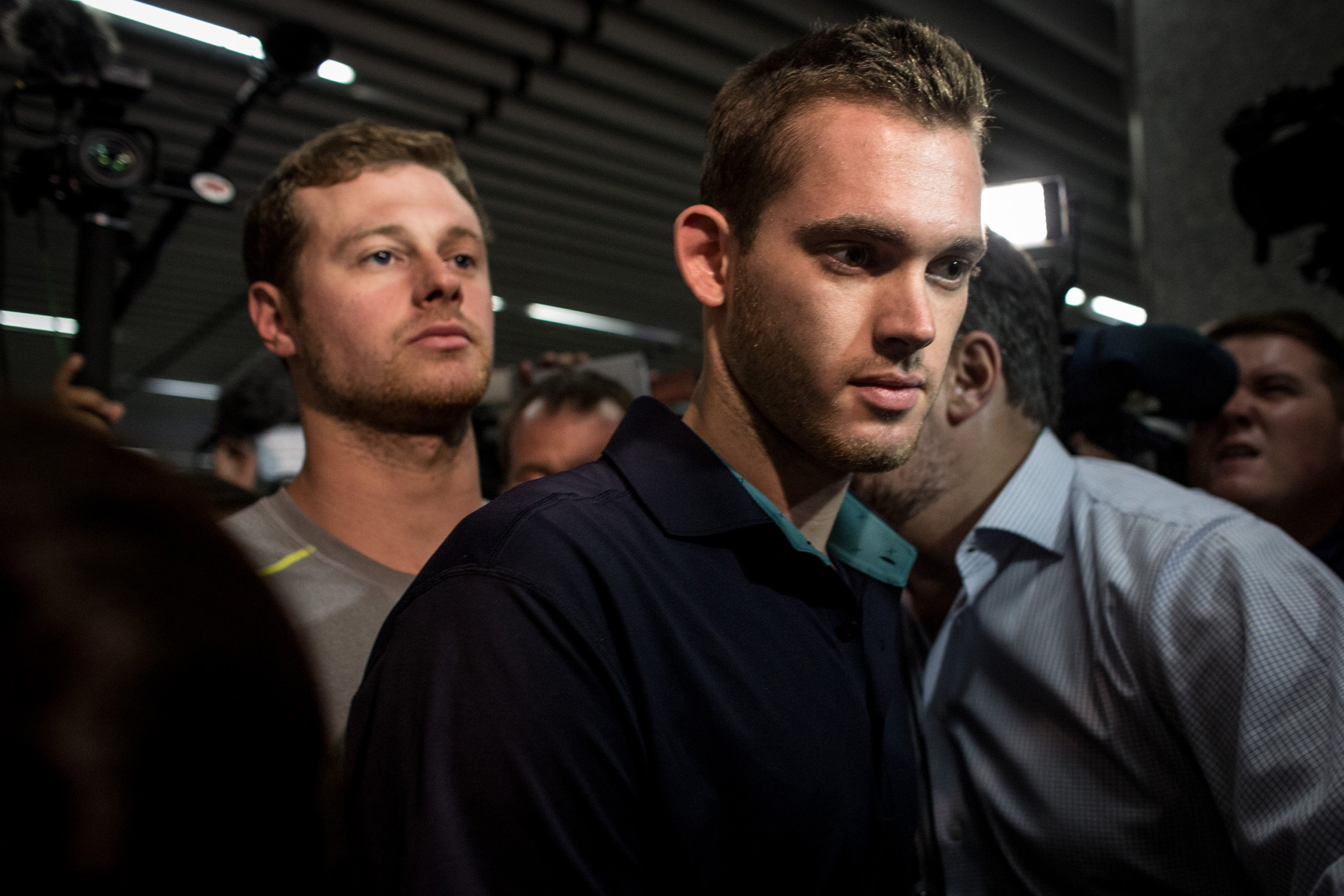 U.S Olympic swimmers Gunnar Bentz and Jack Conger leave the police headquarters at international departures of Rio de Janiero's Galeo International airport in Rio on Aug. 18, 2016. The swimmers were removed from their flight departing for the U.S. by Bra