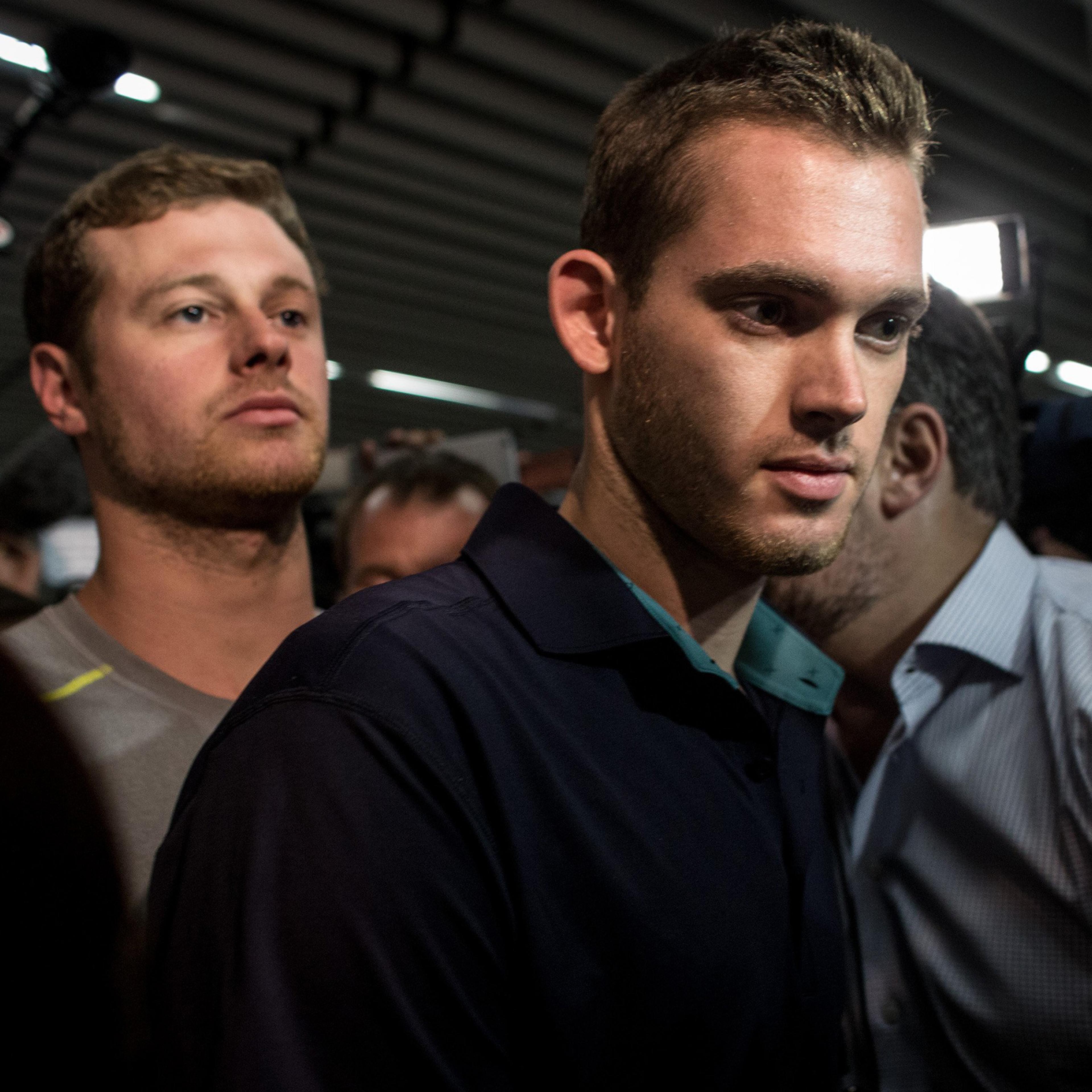 U.S Olympic swimmers Gunnar Bentz and Jack Conger leave the police headquarters at international departures of Rio de Janiero's Galeo International airport in Rio on Aug. 18, 2016. The swimmers were removed from their flight departing for the U.S. by Bra