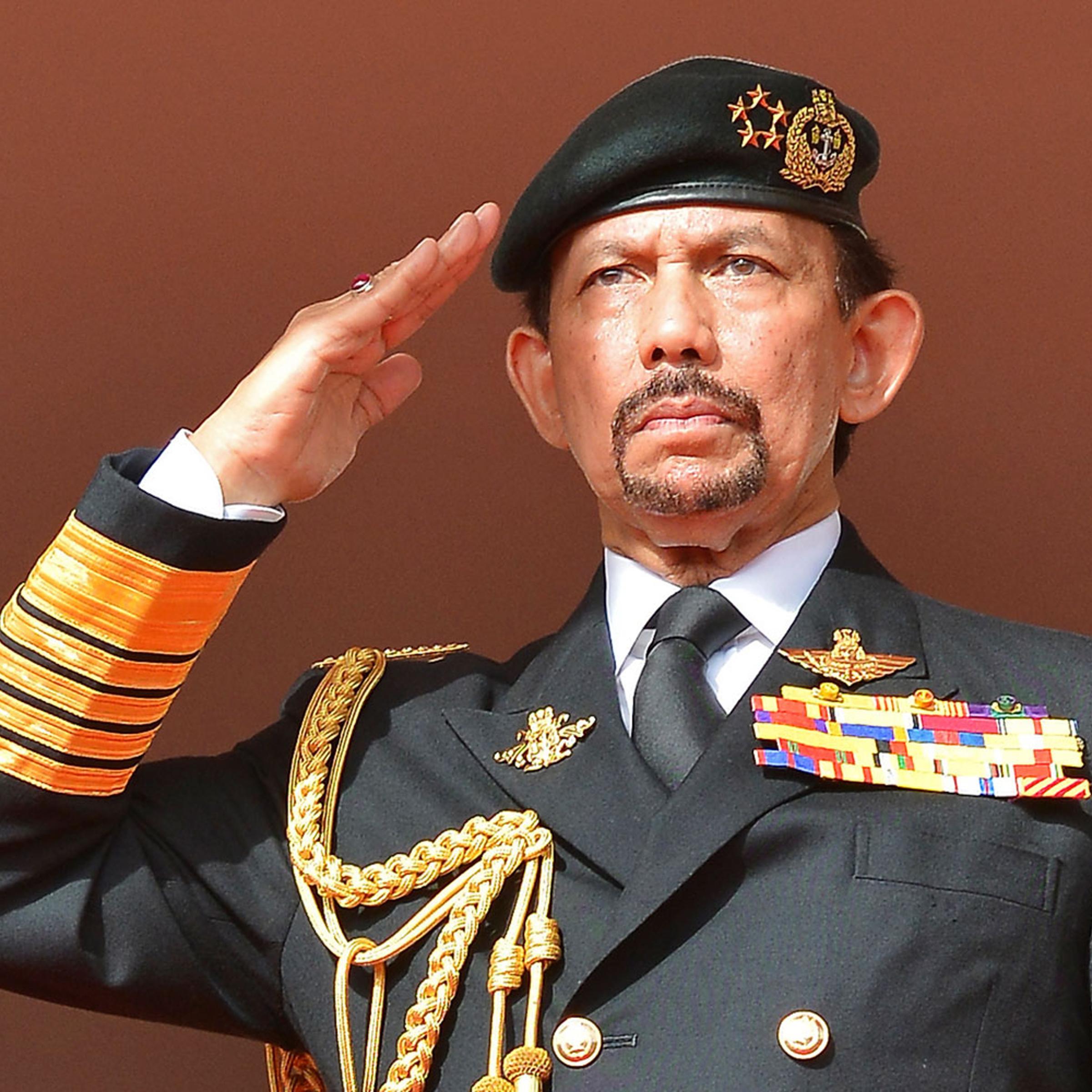 Brunei's Sultan Hassanal Bolkiah salutes as the national anthem is played during celebrations for Brunei's 30th National Day, in Bandar Seri Begawan on Feb. 23, 2014.