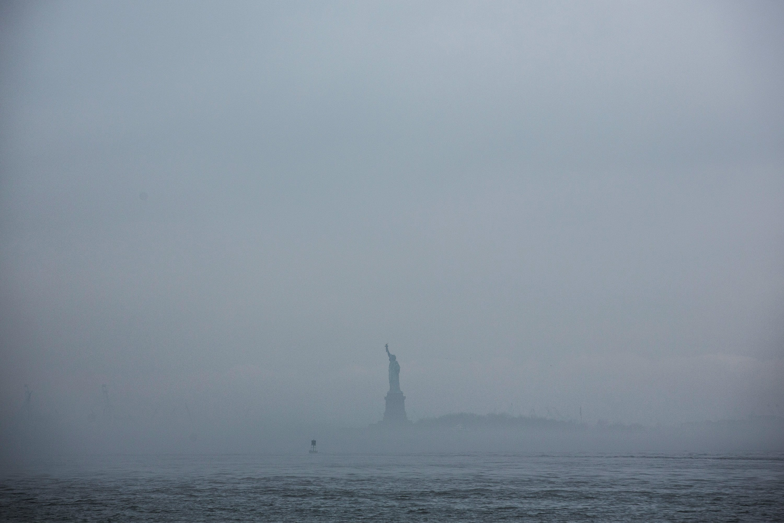 The Statue of Liberty is enveloped in fog on May 1, 2014.
