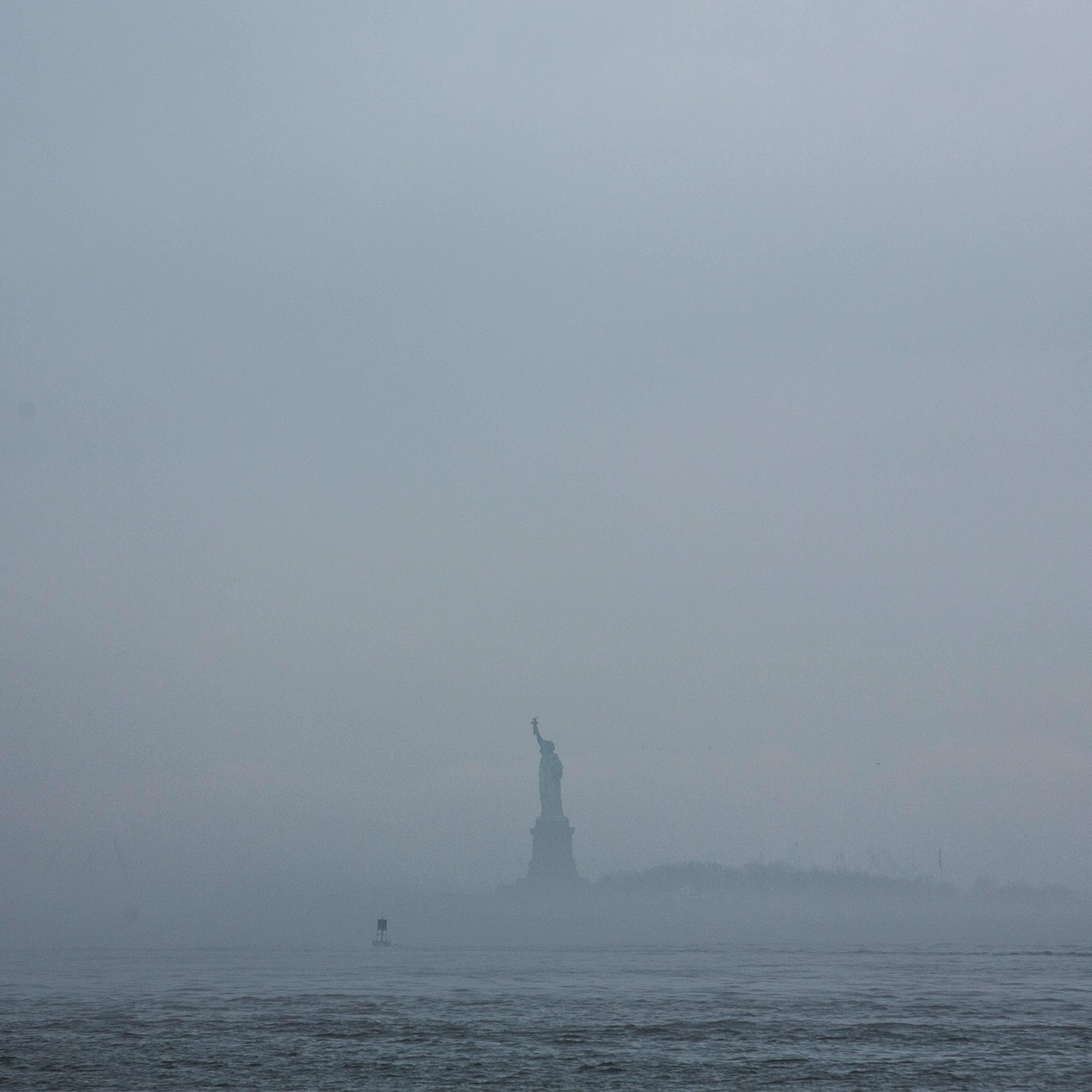 The Statue of Liberty is enveloped in fog on May 1, 2014.