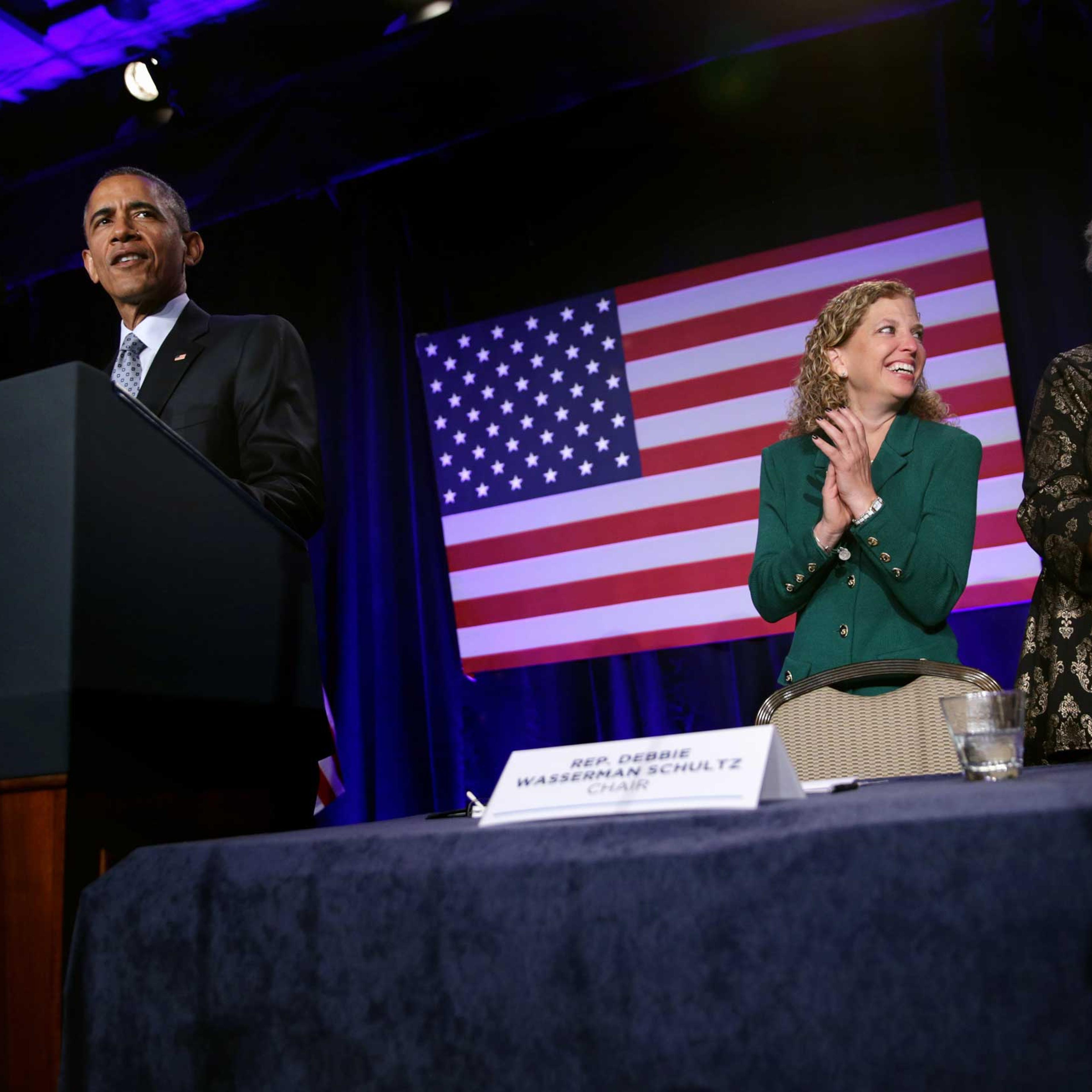 President Obama speaks as Democratic National Committee Chair and Rep. Debbie Wasserman Schultz and Vice Chair for Voter Registration and Participation Donna Brazile share a moment during the General Session of the 2015 DNC Winter Meeting, Feb. 20, 2015
