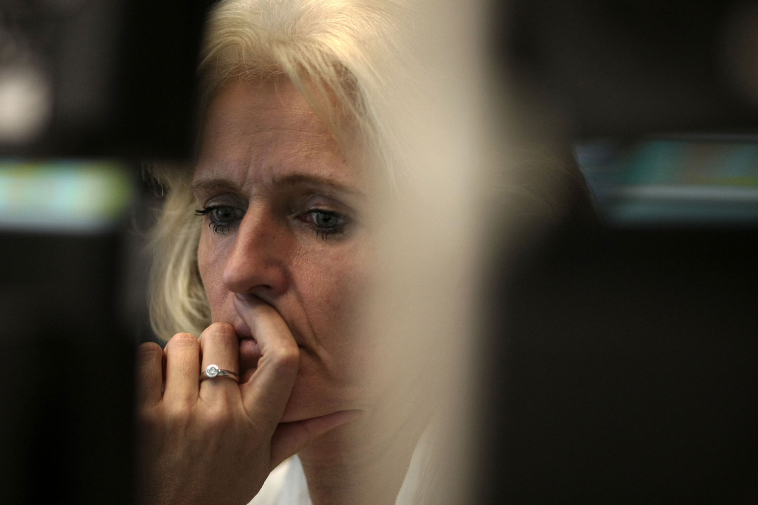 A trader looks to the German DAX stock index at the stock exchange in Frankfurt/Main, Germany, August 9, 2011. Shortly after the Dax indicated a positive trend the index temporarily fell by 7 per cent. 