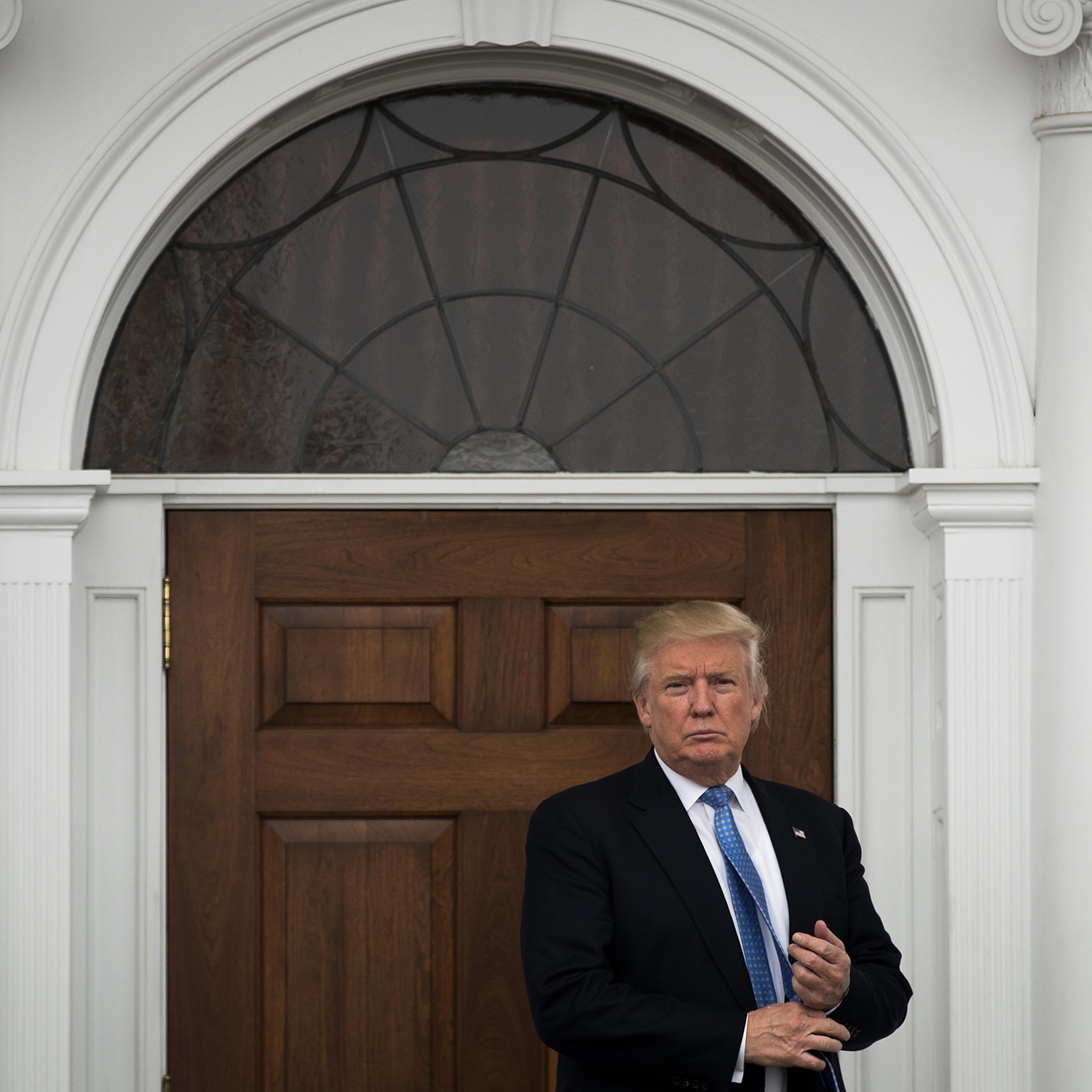 BEDMINSTER TOWNSHIP, NJ - NOVEMBER 20: President-elect Donald Trump stands outside the clubhouse following his meeting with Peter Kirsanow, attorney and member of the U.S. Commission on Civil Rights, at Trump International Golf Club, November 20, 2016 in