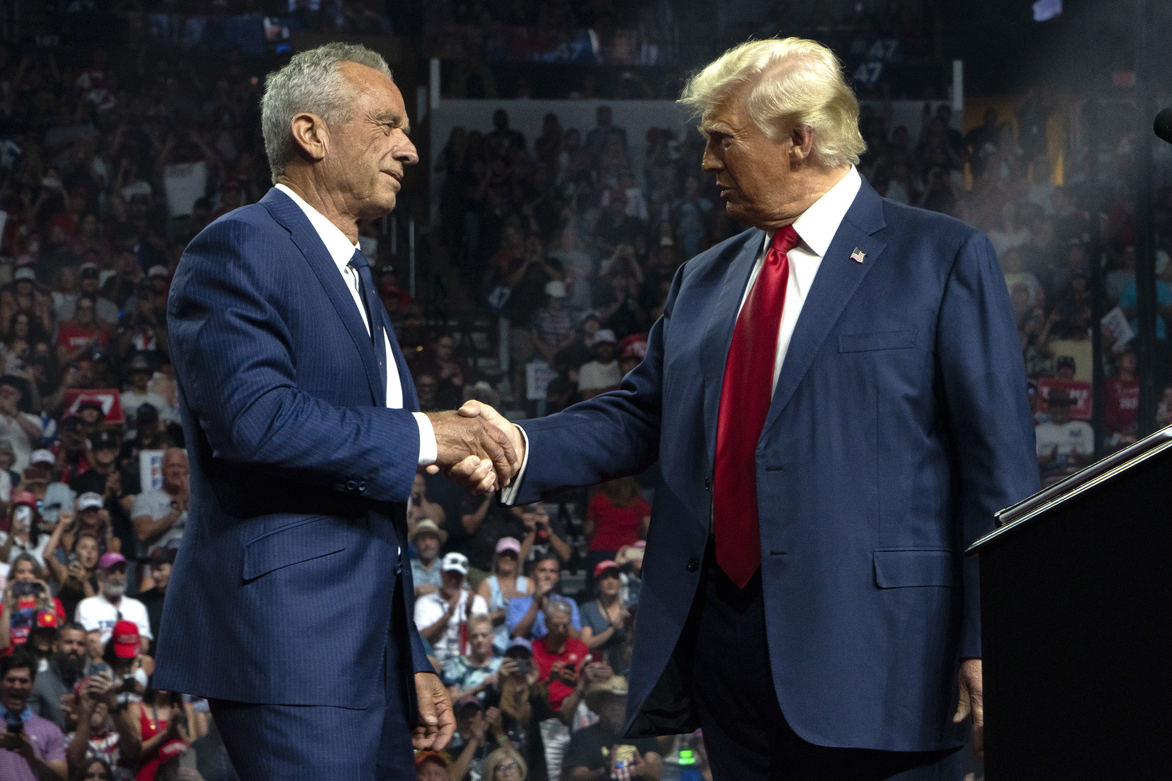 Robert F. Kennedy Jr. and President-elect Donald Trump shake hands during a campaign rally at Desert Diamond Arena Glendale, Ariz. on Aug. 23.