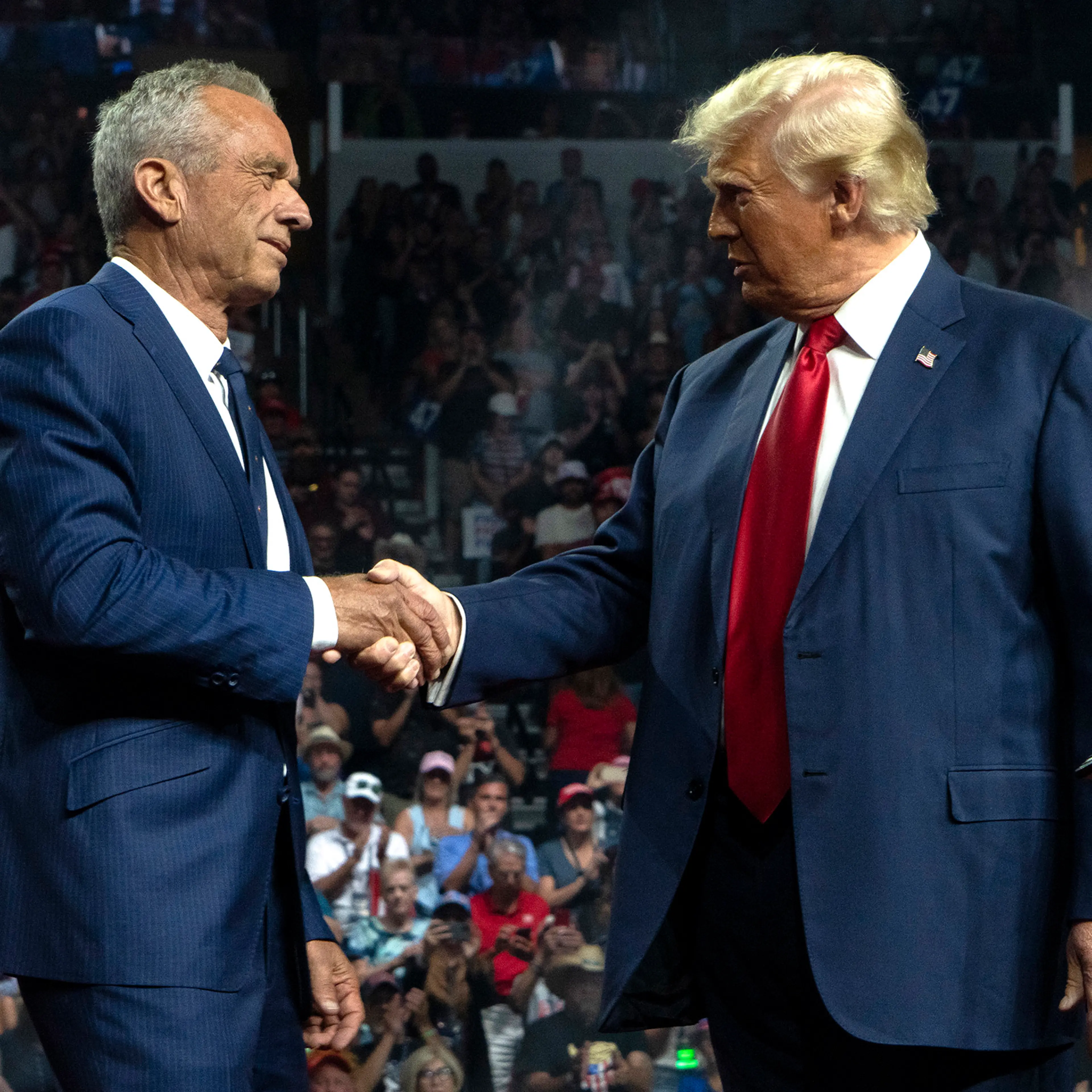 Robert F. Kennedy Jr. and President-elect Donald Trump shake hands during a campaign rally at Desert Diamond Arena Glendale, Ariz. on Aug. 23.