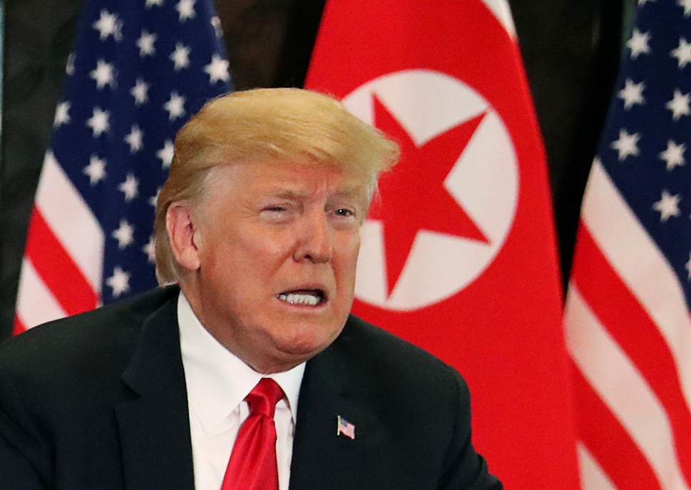 U.S. President Donald Trump attends a signing ceremony with North Korea's leader Kim Jong Un during a summit at the Capella Hotel on the resort island of Sentosa, Singapore