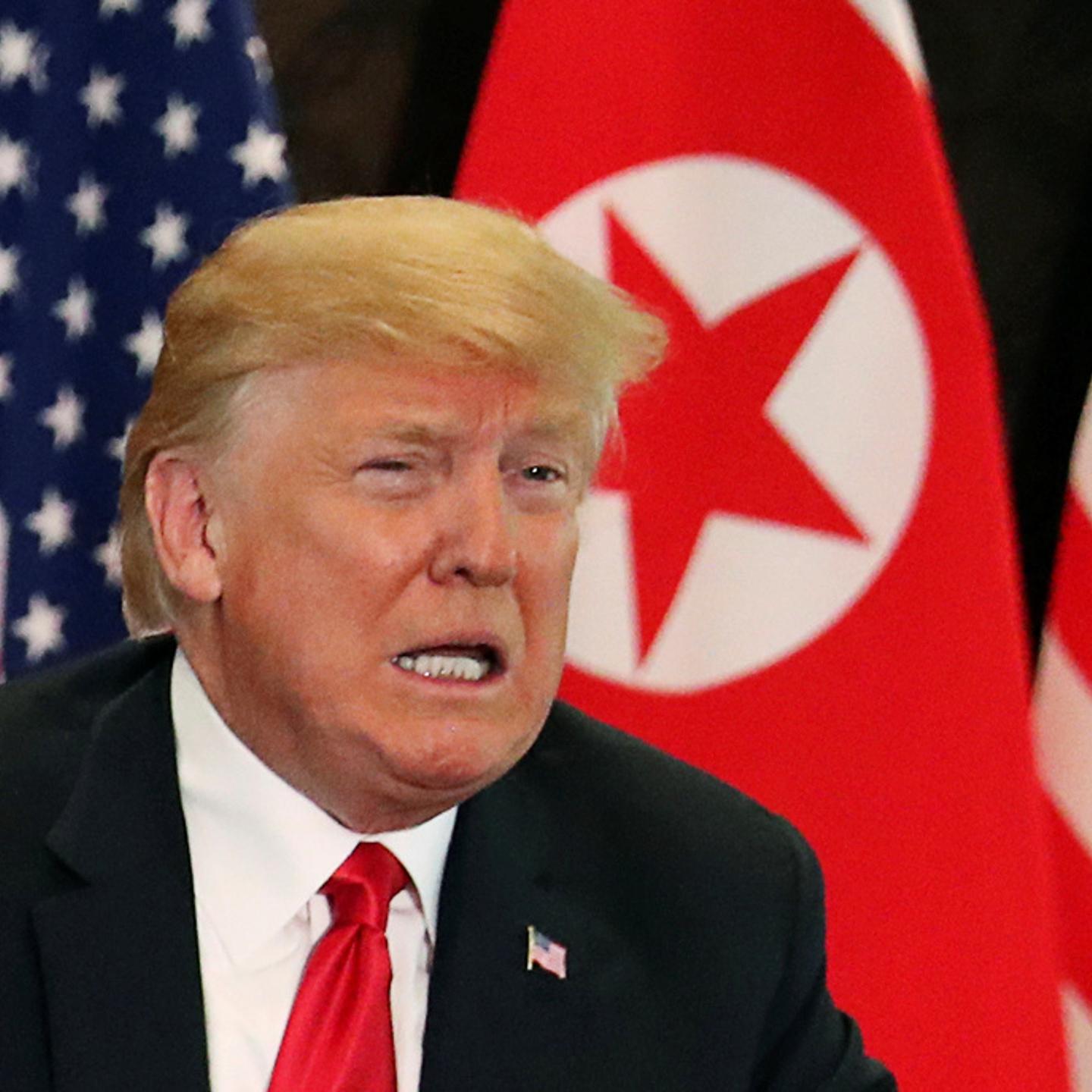 U.S. President Donald Trump attends a signing ceremony with North Korea's leader Kim Jong Un during a summit at the Capella Hotel on the resort island of Sentosa, Singapore