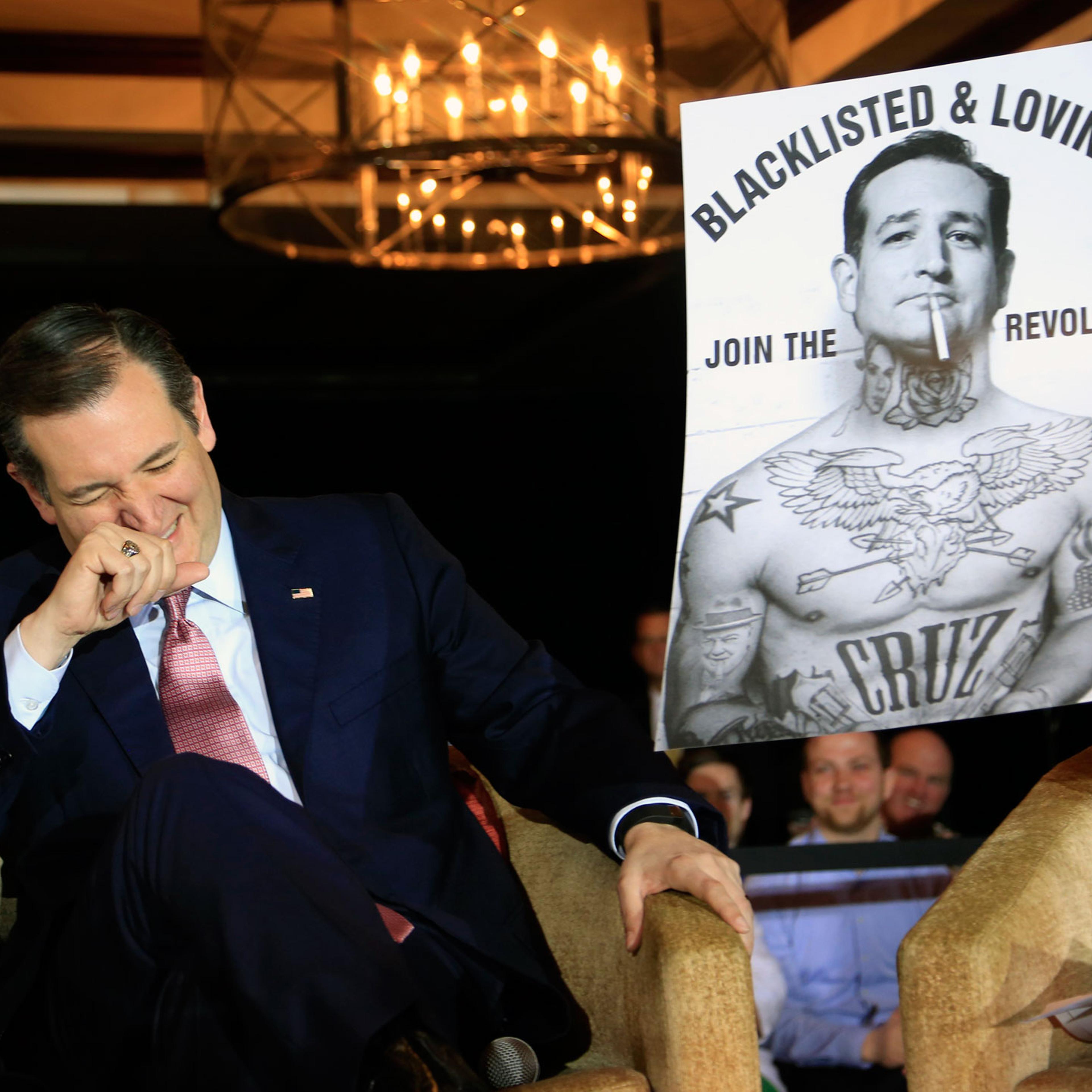Republican presidential candidate, Texas Sen. Ted Cruz laughs at a poster in his likeness at a town hall event on March 30, 2016 in Madison, Wis.