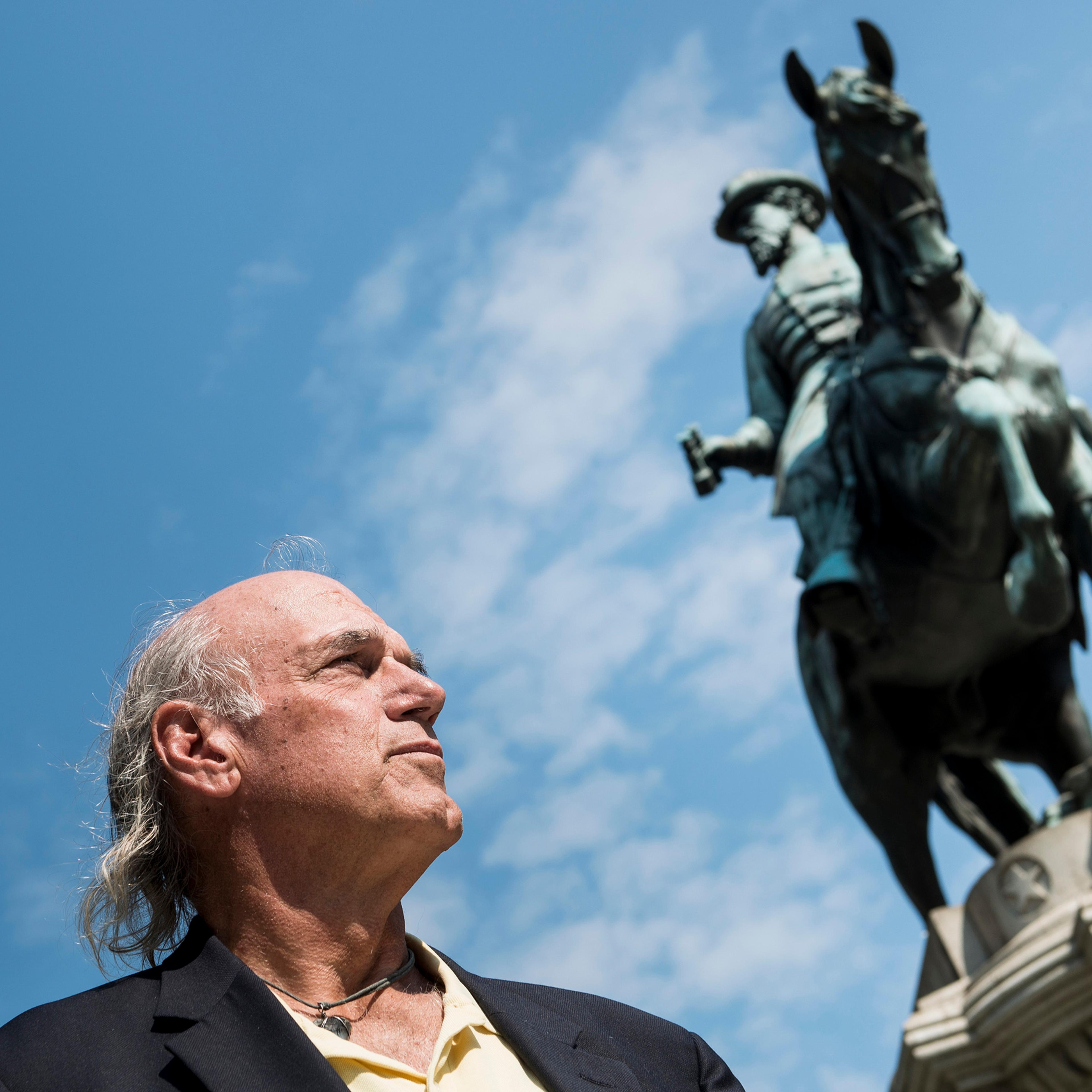 Former pro wrestler Jesse Ventura pauses while speaking about his book "They Killed Our President" in Washington, DC on Oct. 4, 2013.