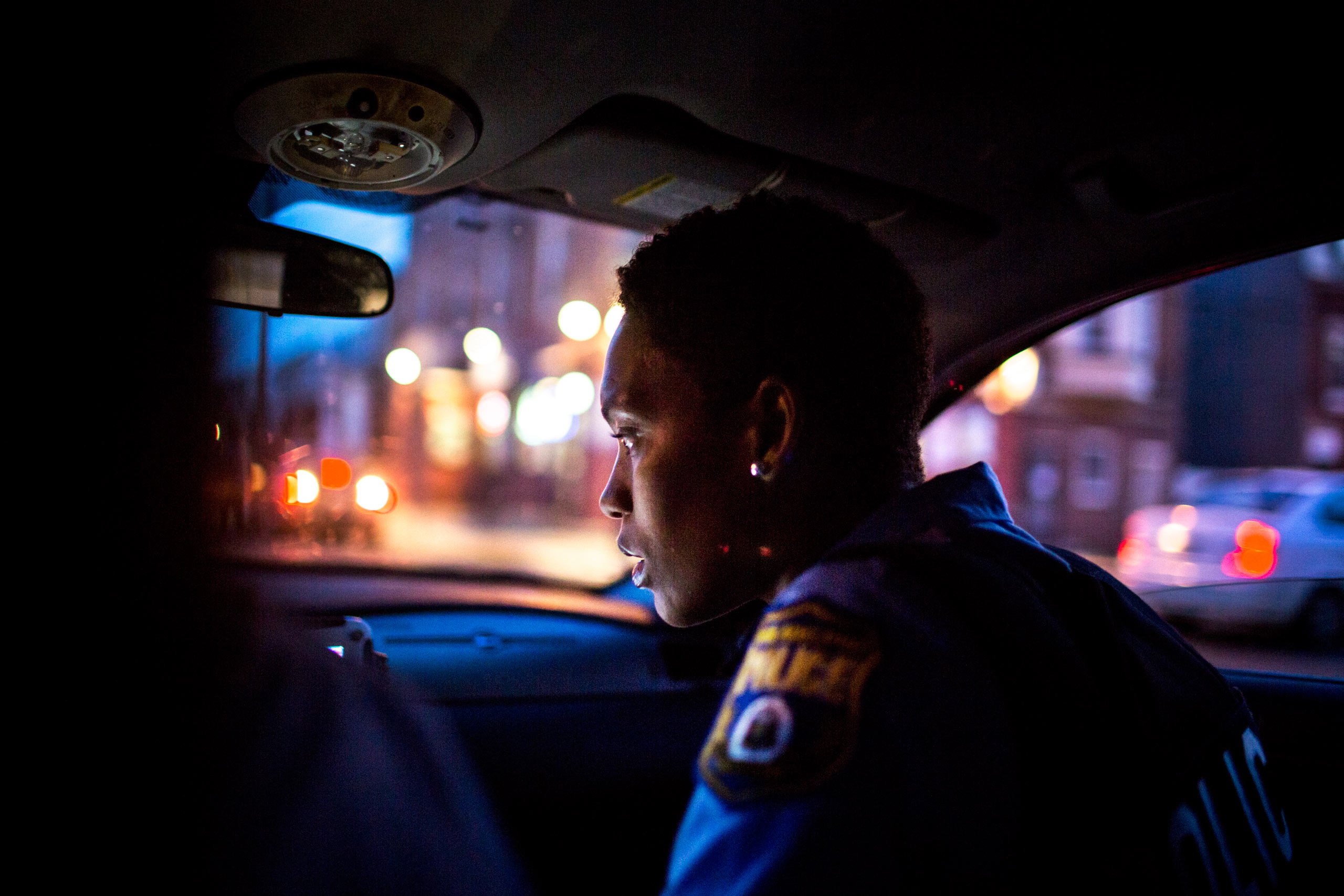July 29th, 2015. Philadelphia PA. Officer Jade Howard inspects the patrol car's computer which gives information about incoming radio calls and suspects.