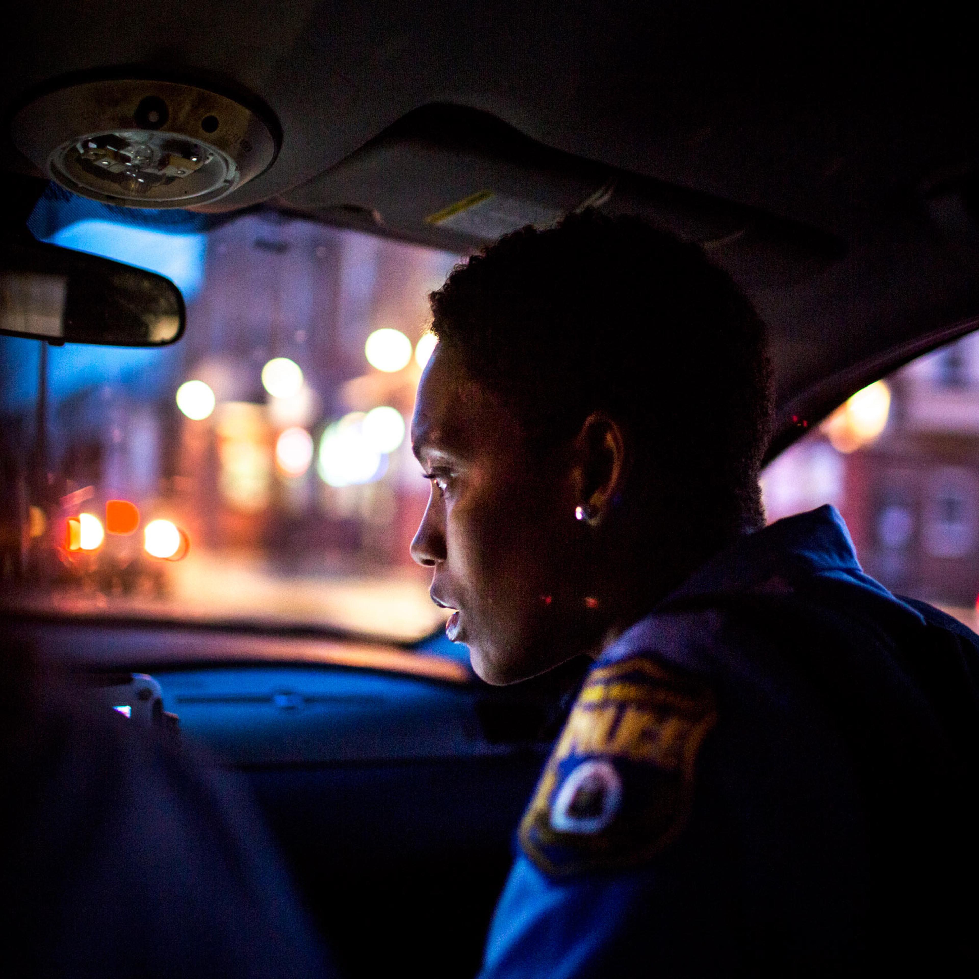 July 29th, 2015. Philadelphia PA. Officer Jade Howard inspects the patrol car's computer which gives information about incoming radio calls and suspects.