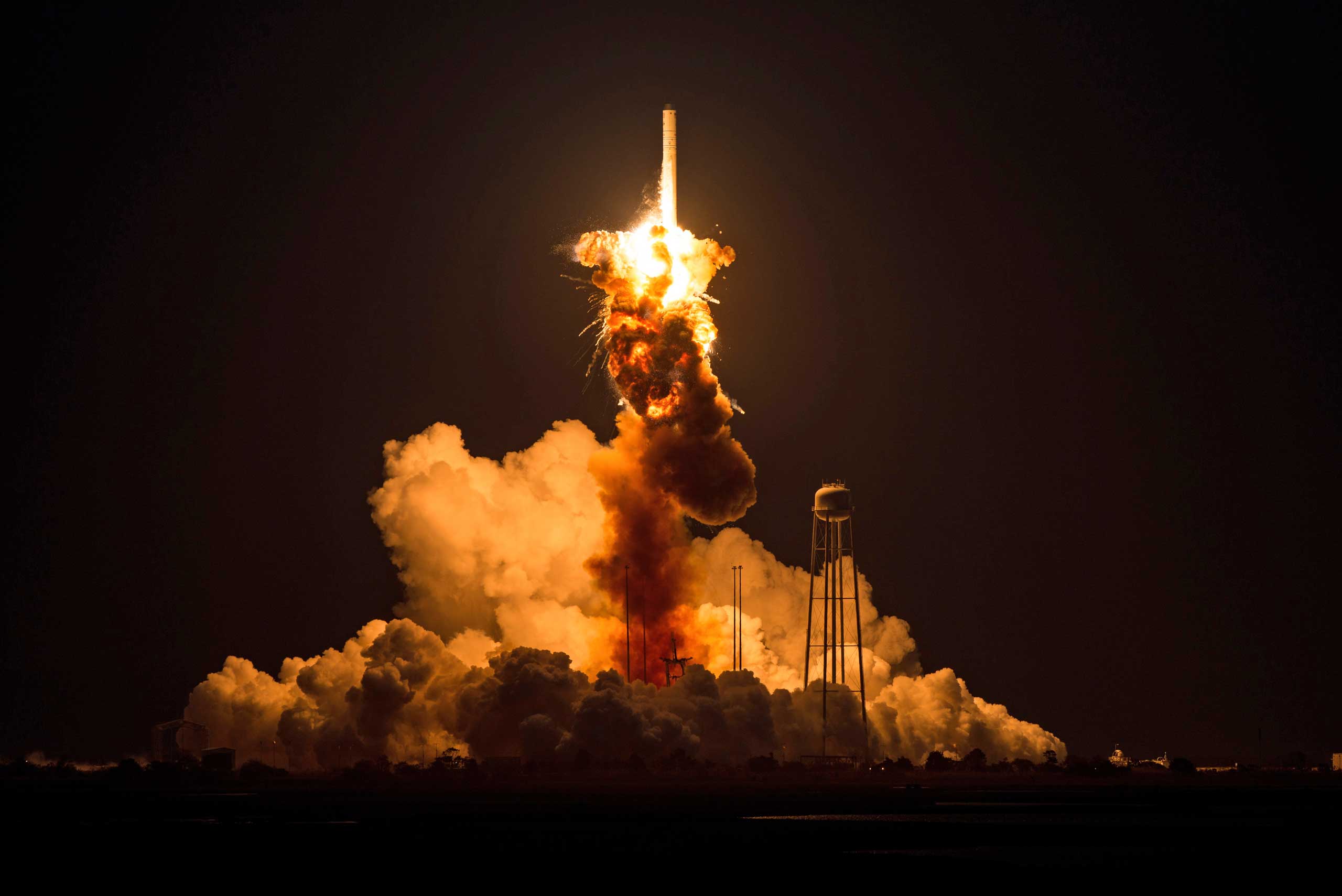 This image provided by NASA shows the Orbital Sciences Corporation Antares rocket, with the Cygnus spacecraft onboard suffers a catastrophic anomaly moments after launch from the Mid-Atlantic Regional Spaceport Pad 0A, Oct. 28, 2014, at NASA's Wallops Fl