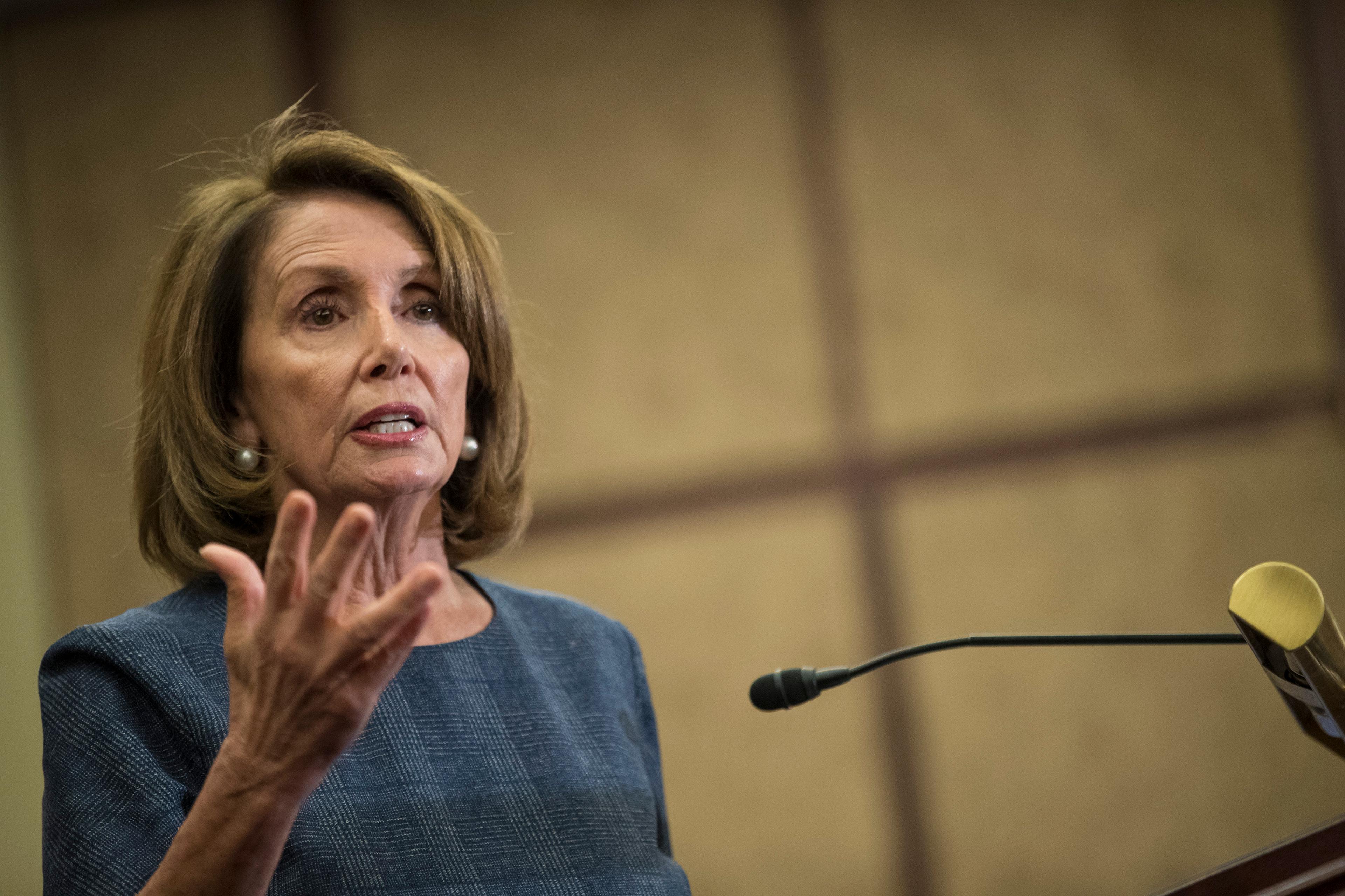 House Minority Leader Nancy Pelosi (D-CA), flanked by House Democrats, speaks about the Affordable Care Act on Capitol Hill Jan. 12, 2017 in Washington, DC.