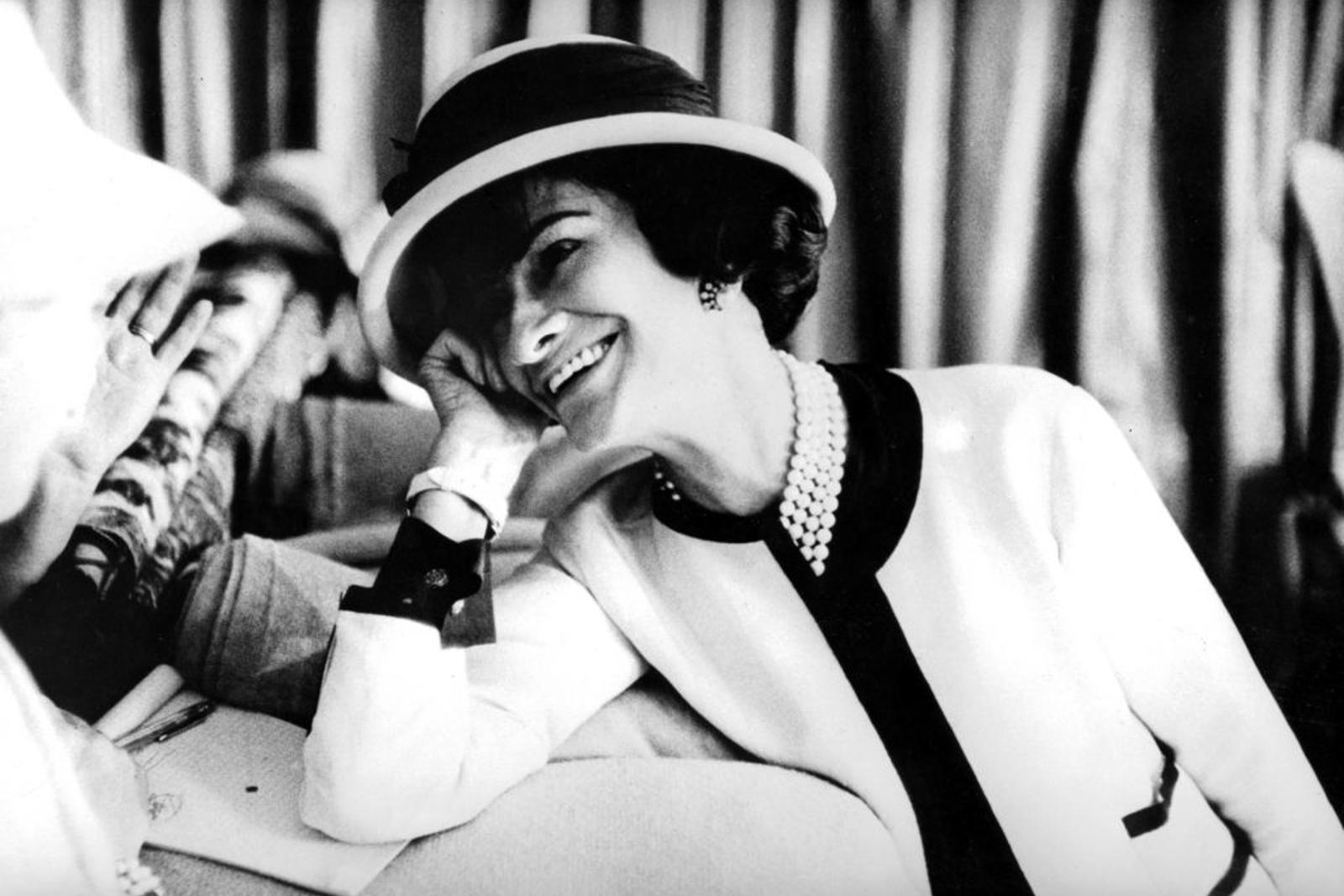 Coco Chanel in a white suit, a common fashion-history example of white worn beyond old seasonal rules