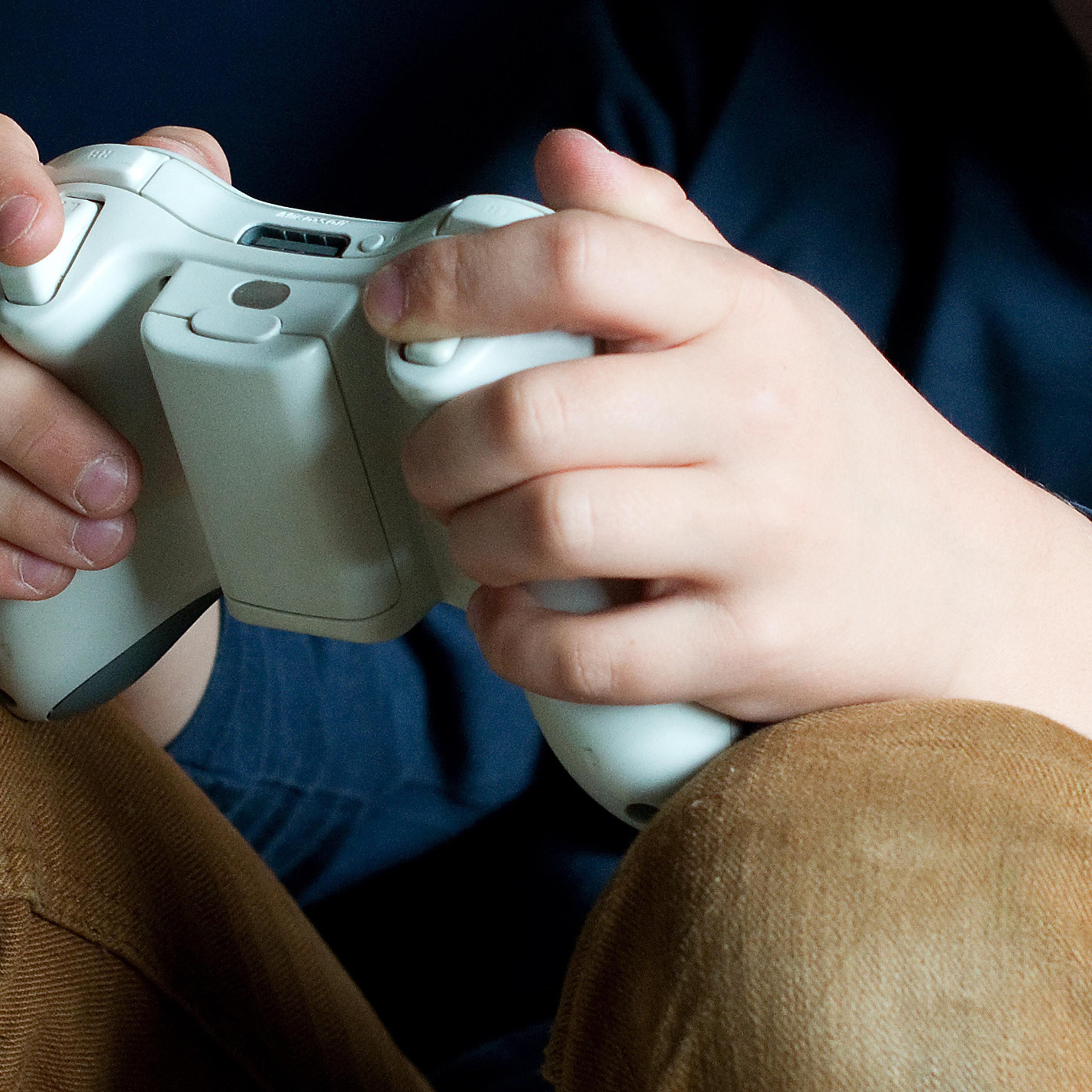 A seven year old boy plays with a Microsoft Xbox 360 on March 22, 2014 in Göttingen, Germany.