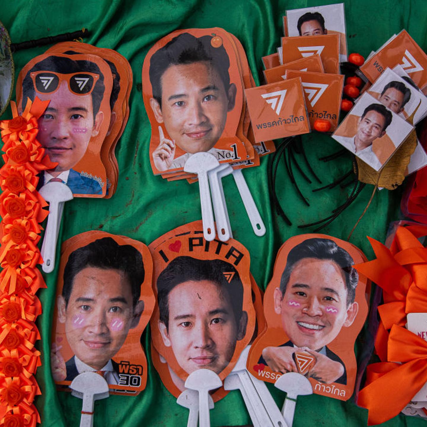 Fans of Pita Limjaroenrat, seen holding pictures of him
