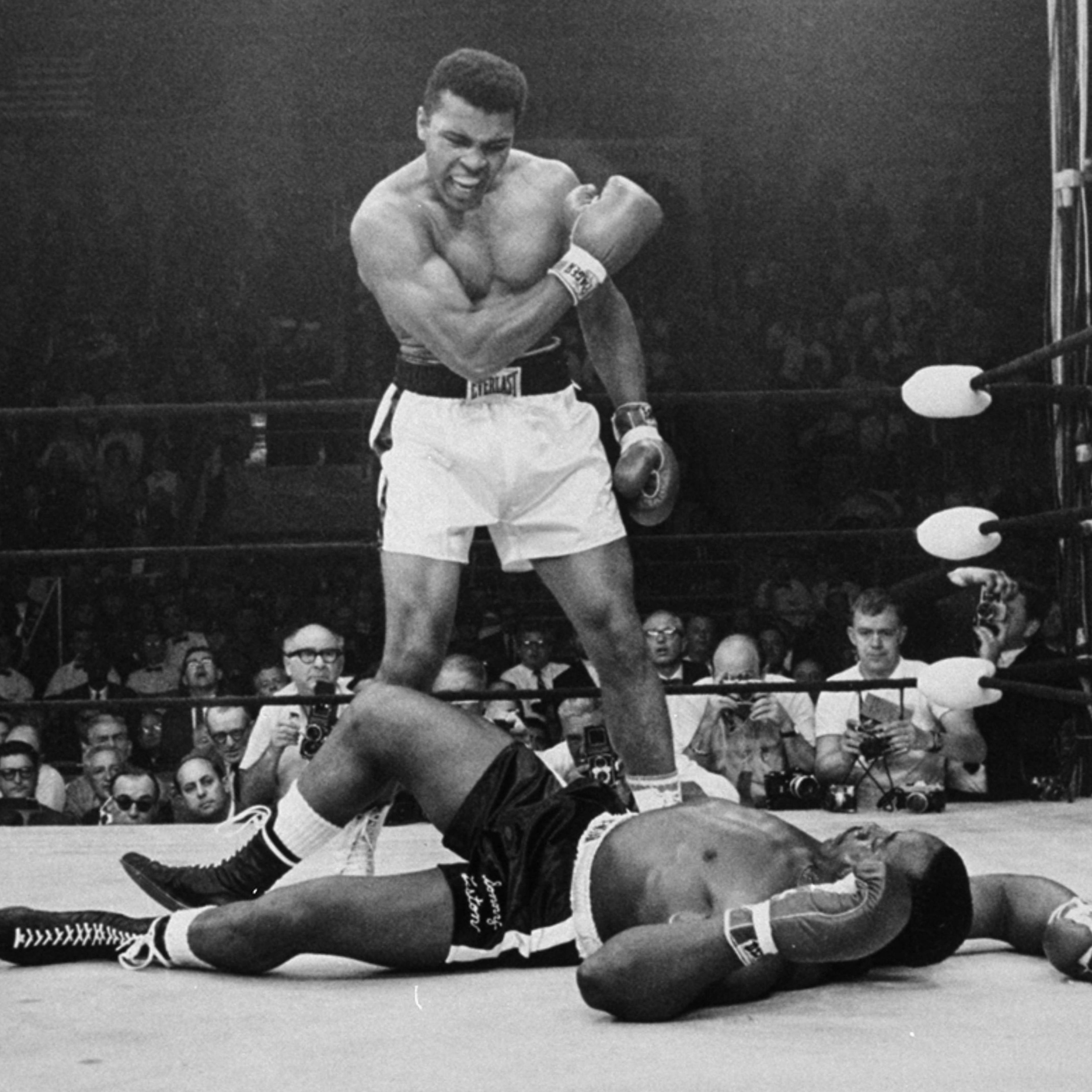 Heavyweight champion Muhammad Ali stands over fallen challenger Sonny Liston, shouting and gesturing shortly after dropping Liston with a short hard right to the jaw on May 25, 1965, in Lewiston, Maine. The bout lasted only one minute into the first roun